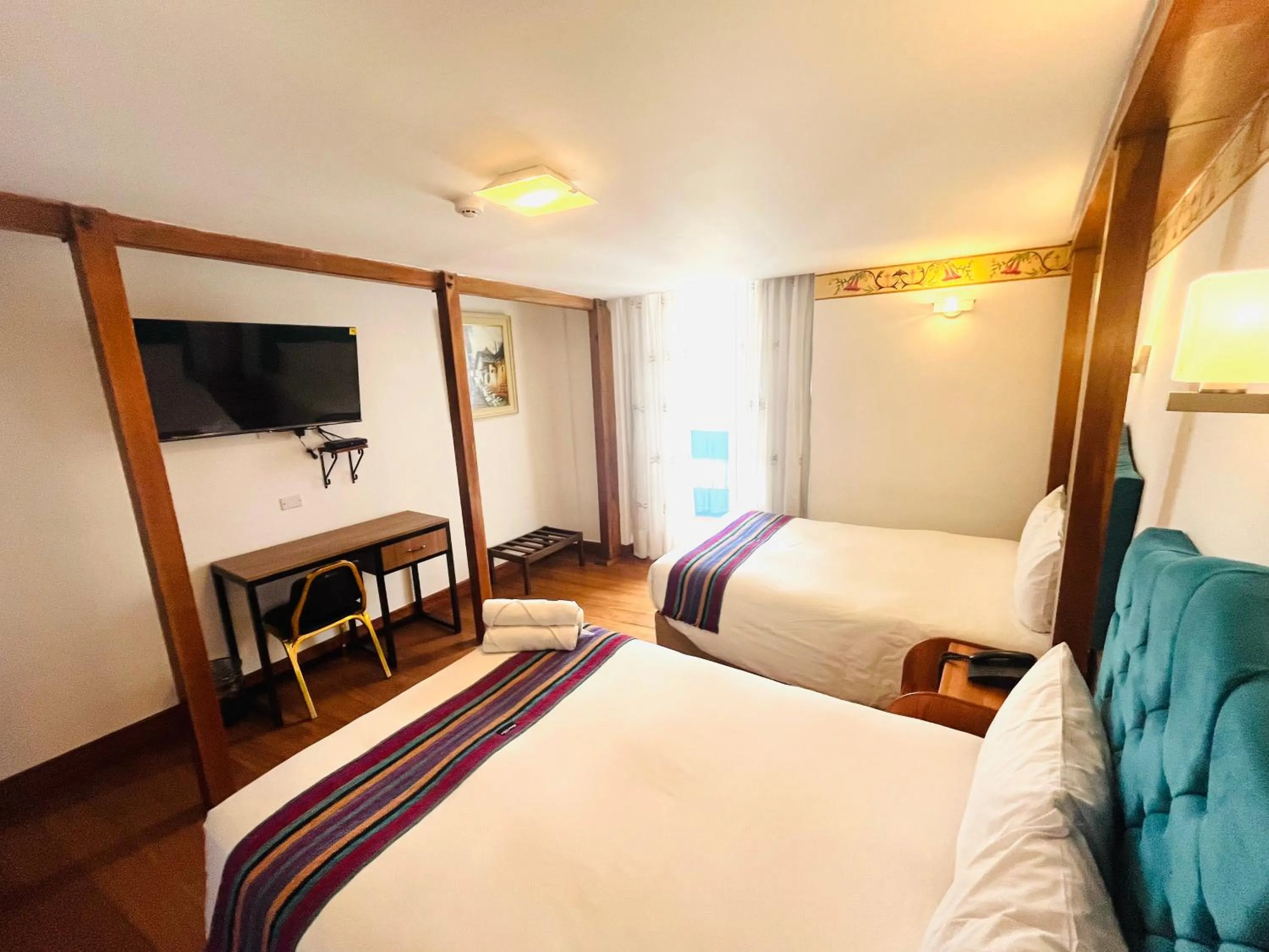 Photo of the whole room, Bed in Rojas Plaza Boutique
