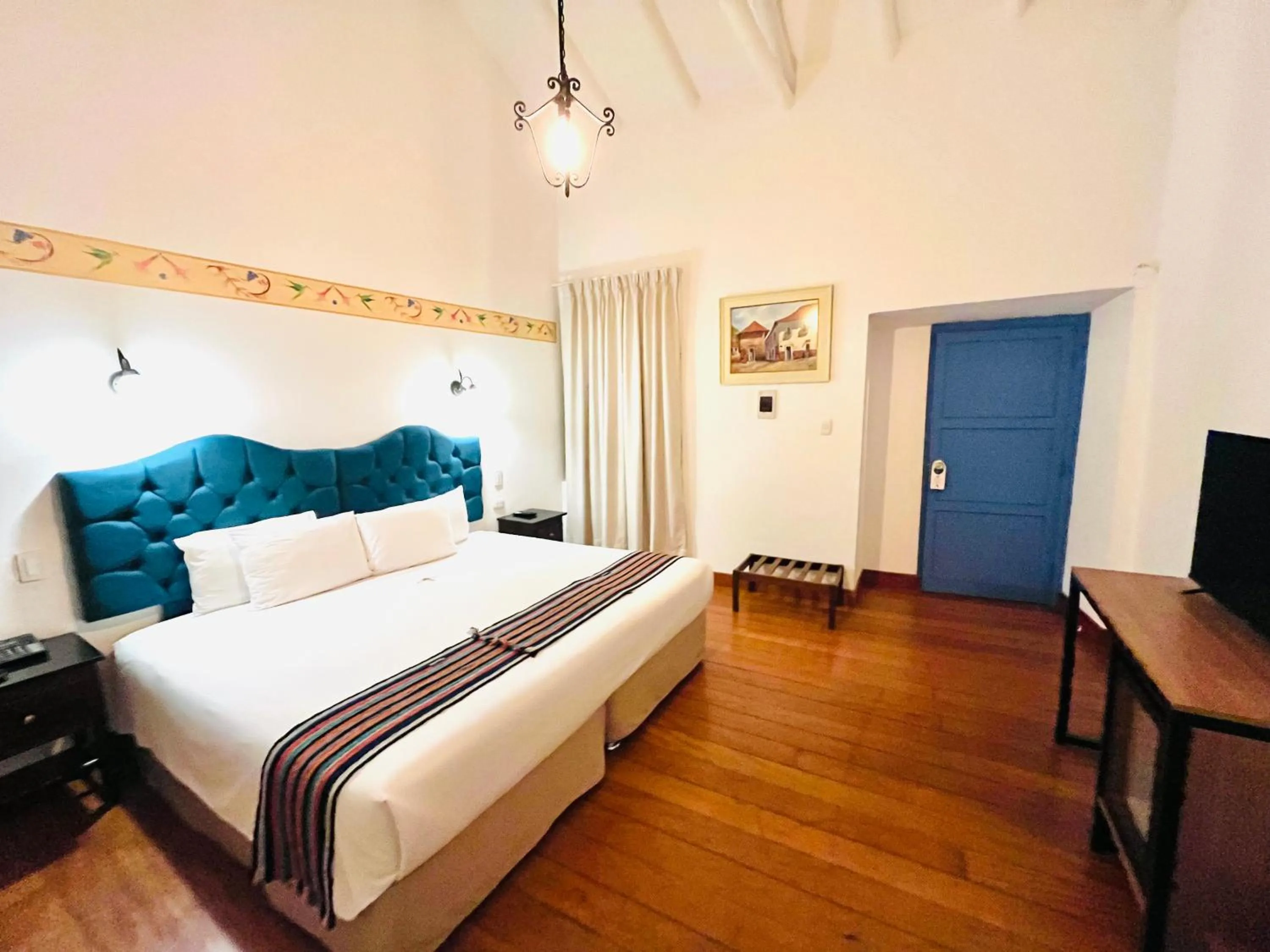 Photo of the whole room, Bed in Rojas Plaza Boutique