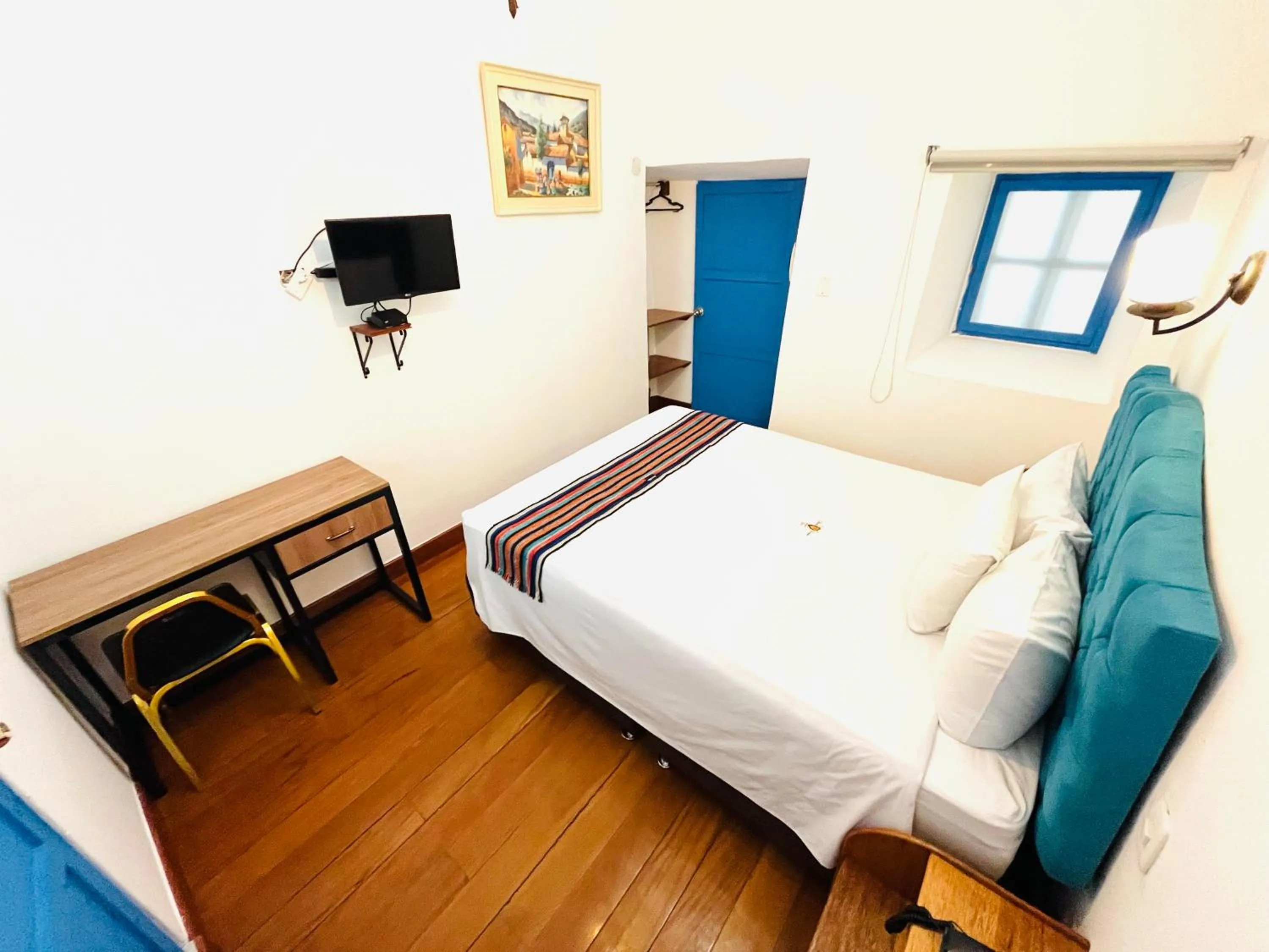 Photo of the whole room, Bed in Rojas Plaza Boutique