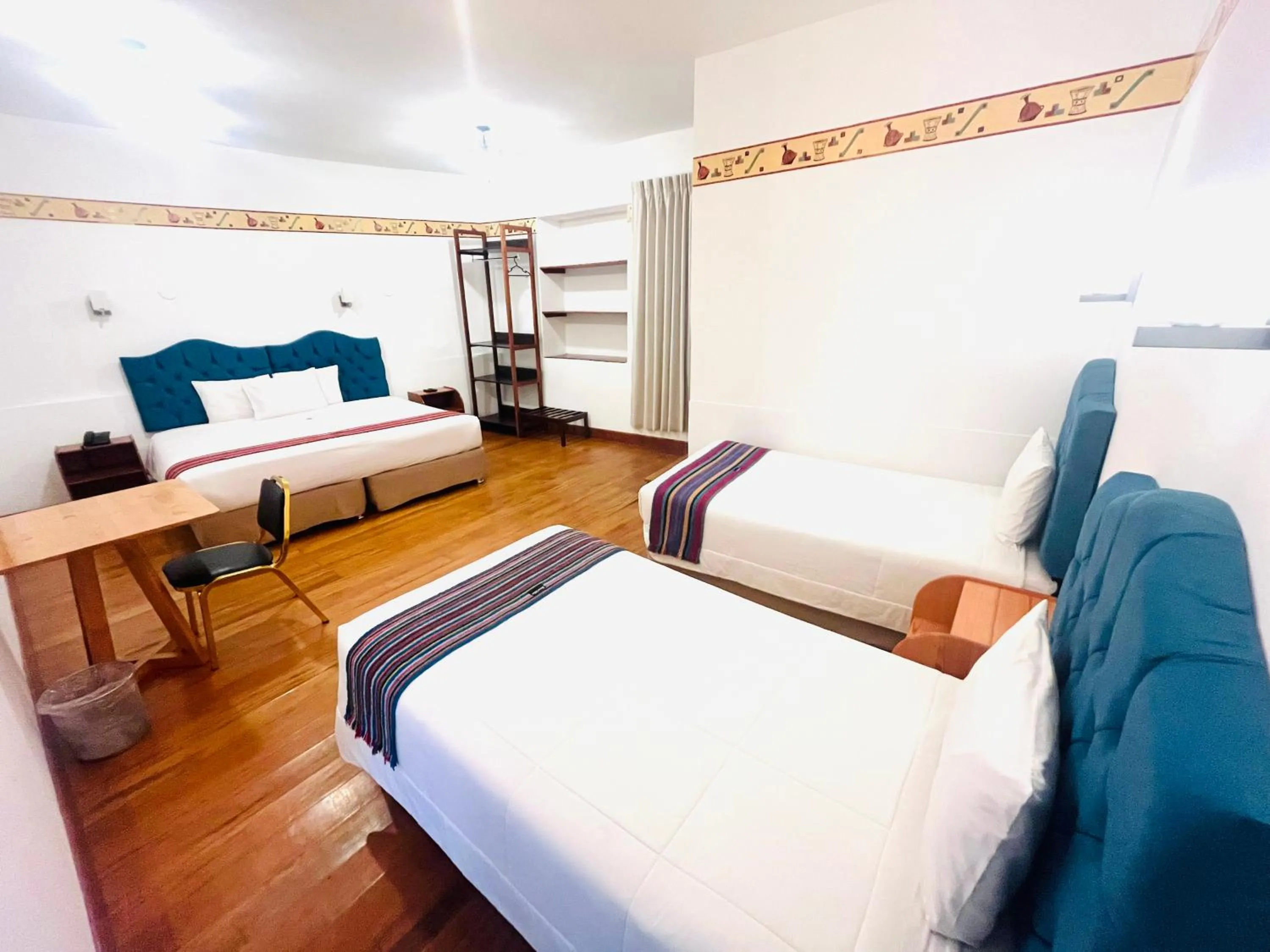 Photo of the whole room, Bed in Rojas Plaza Boutique