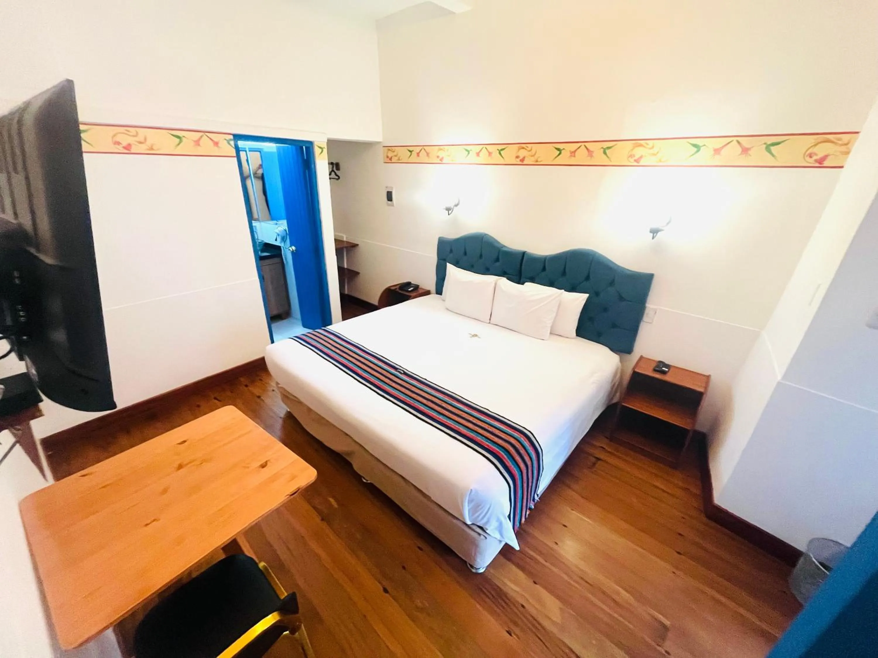 Photo of the whole room, Bed in Rojas Plaza Boutique