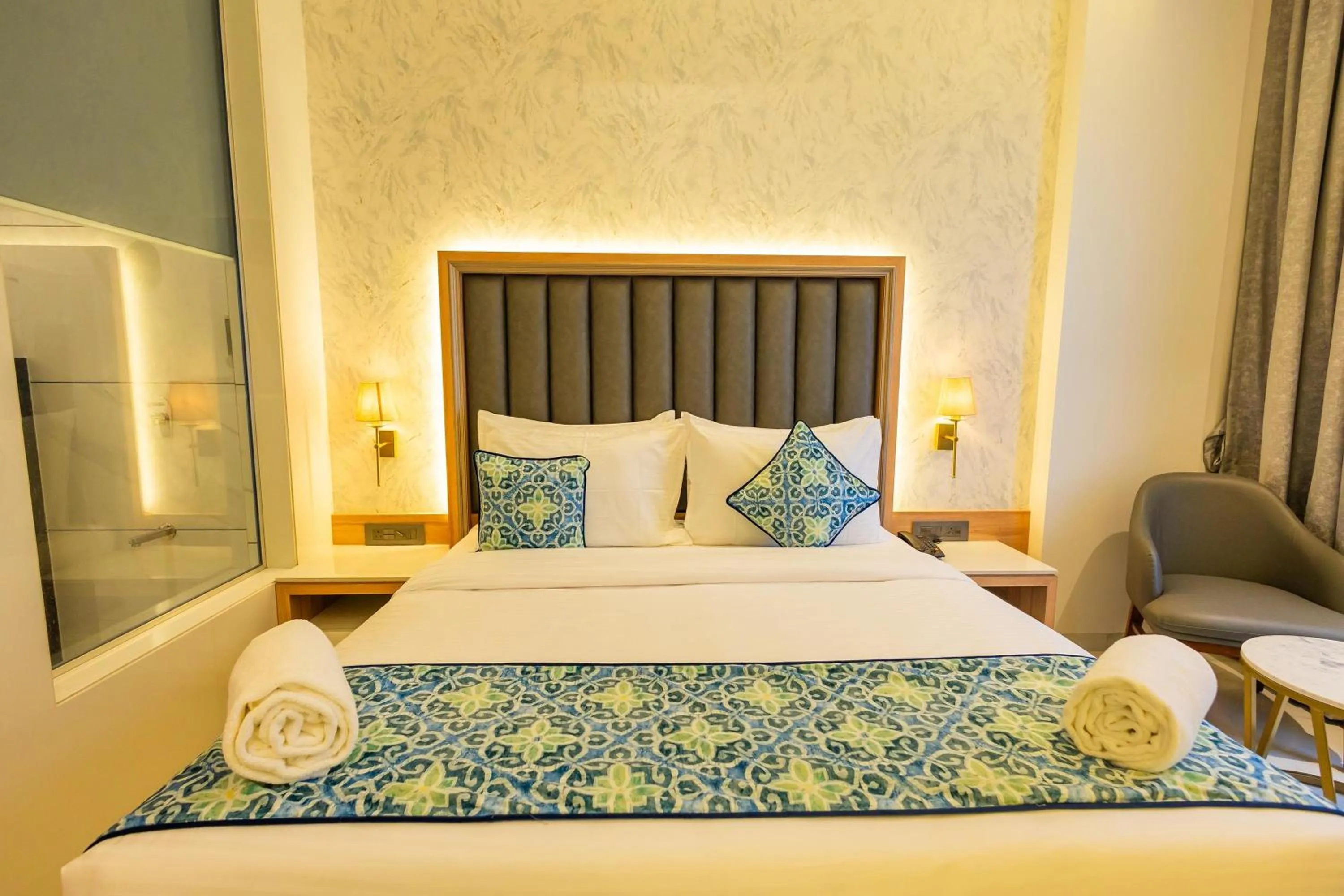 Bed in Shera Hotels & Banquets