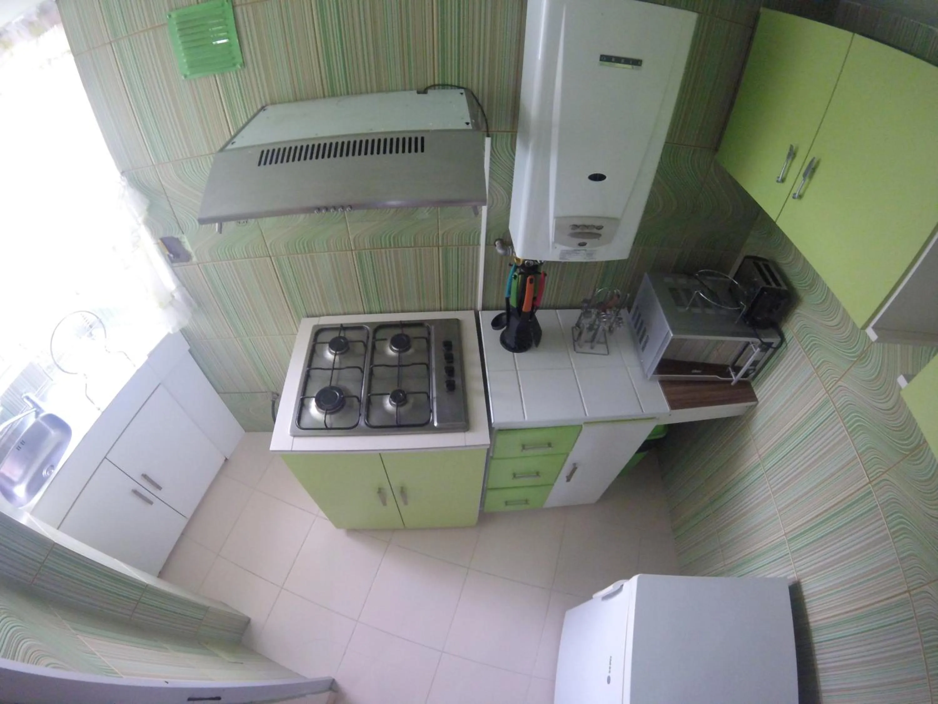 Kitchen or kitchenette in Almudena Apart Hotel