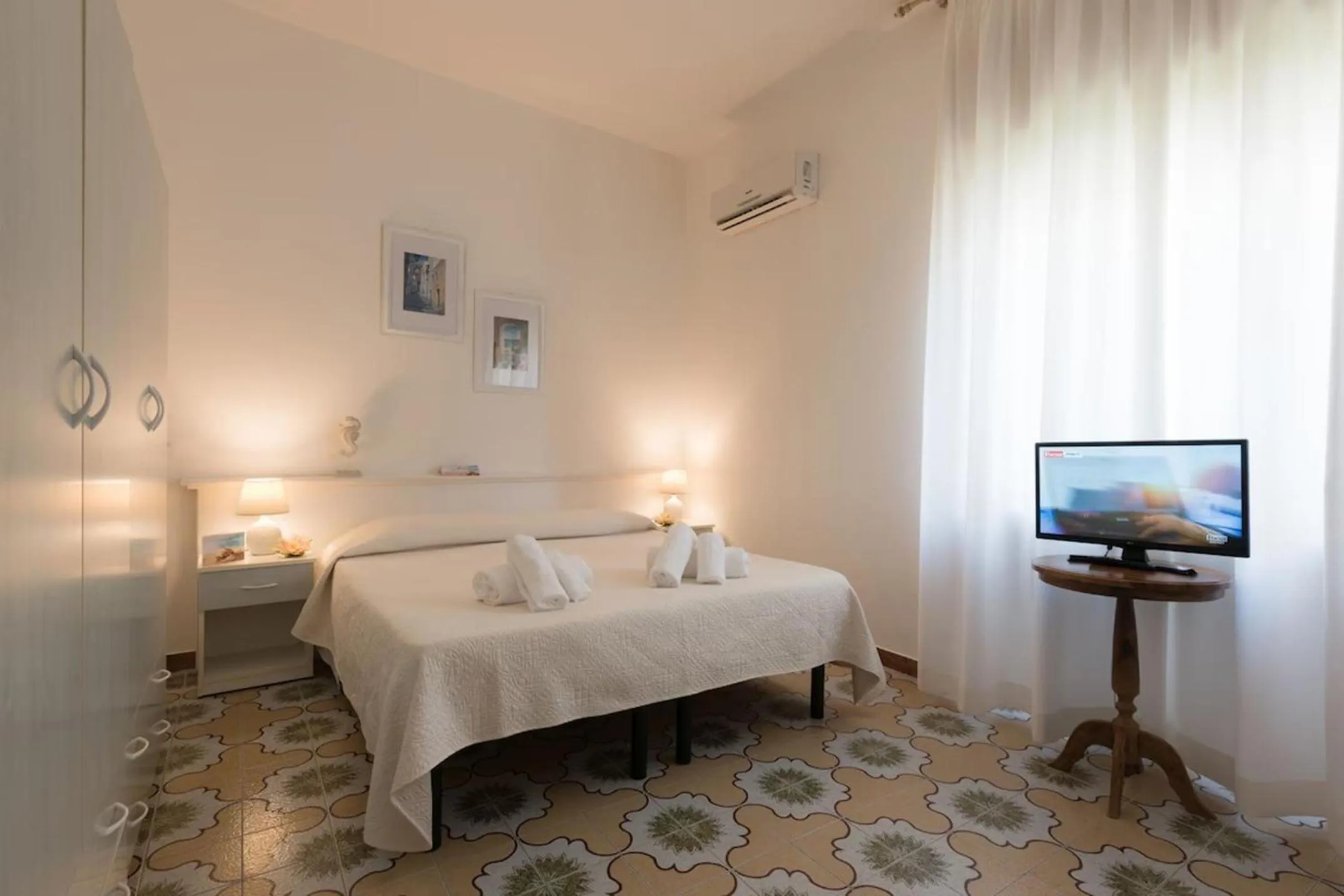 Bed in Le Gemelle Boutique Hotel