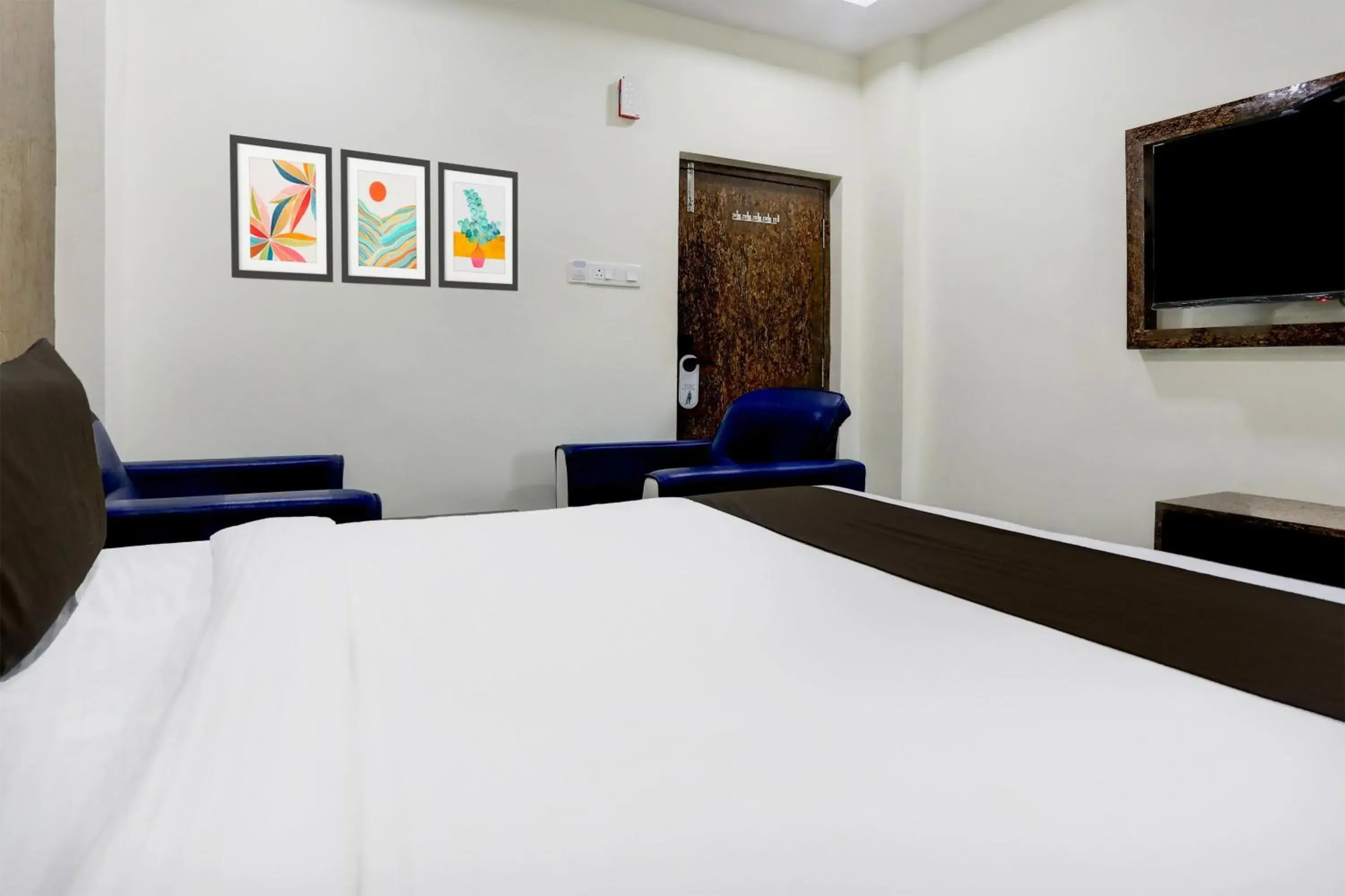 Bedroom, Bed in Super Townhouse Khammam Formerly Bluemoon Bedroom, Bed in Super Townhouse Khammam Formerly Bluemoon