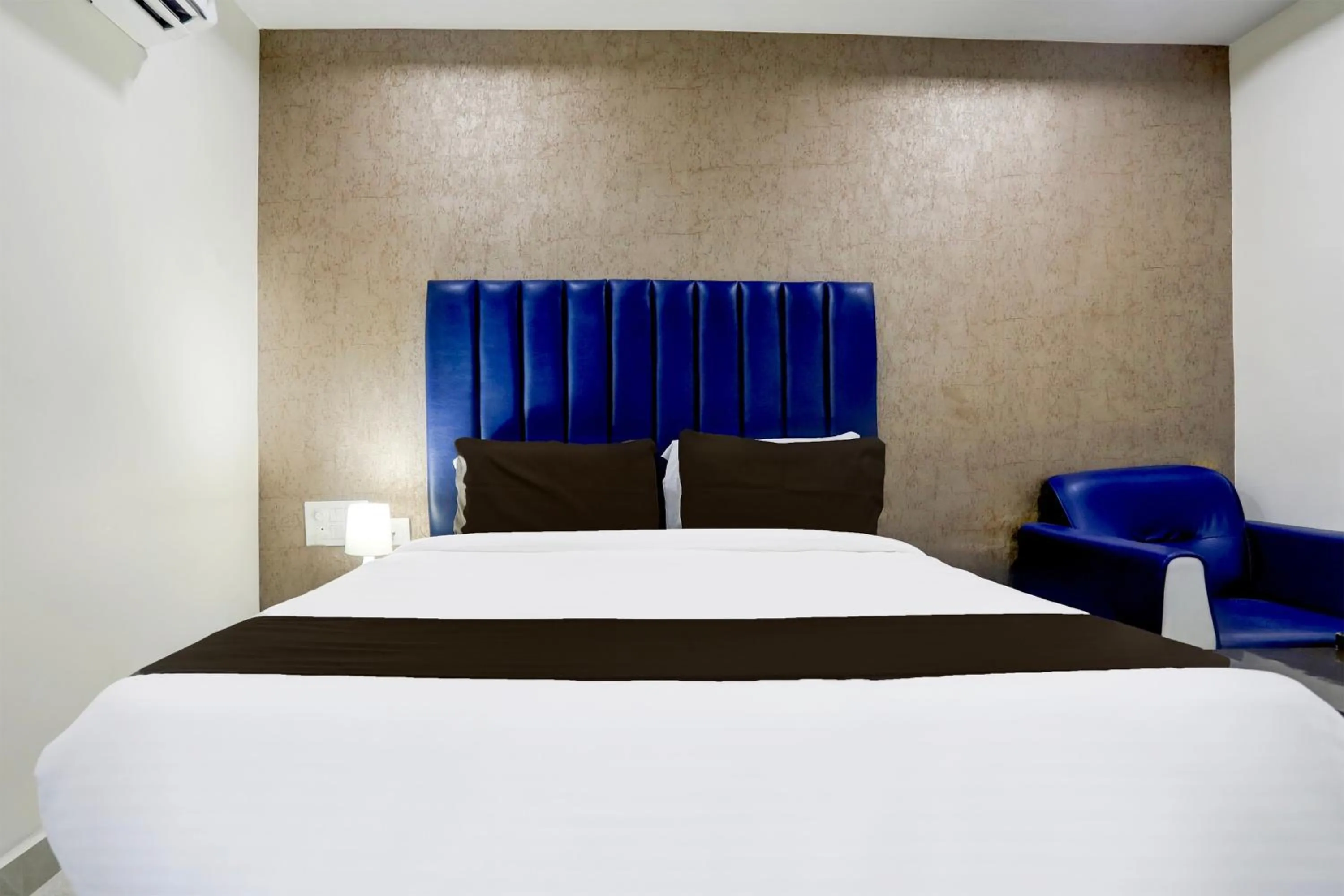 Bedroom, Bed in Super Townhouse Khammam Formerly Bluemoon