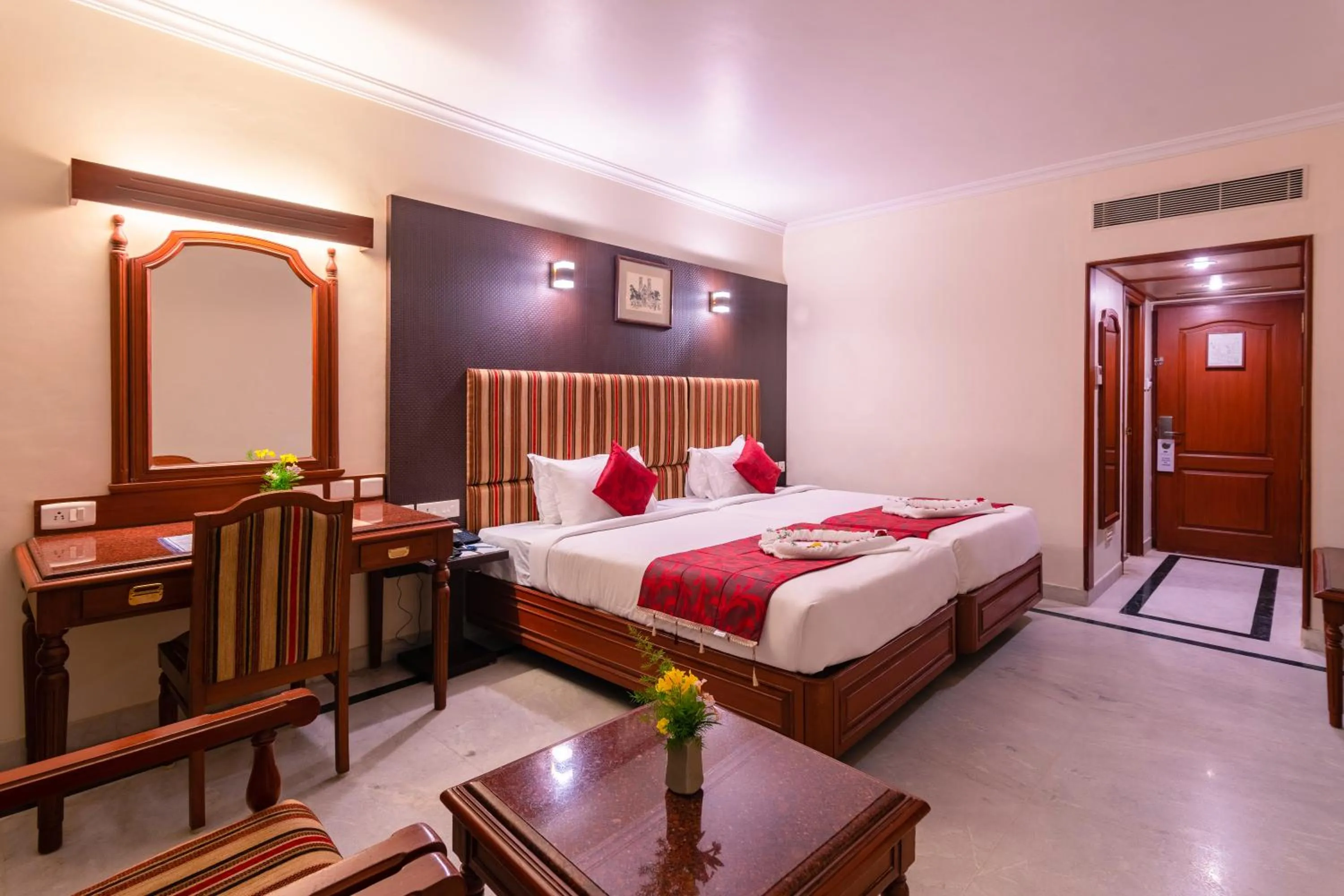 Bed in Hotel Annamalai International