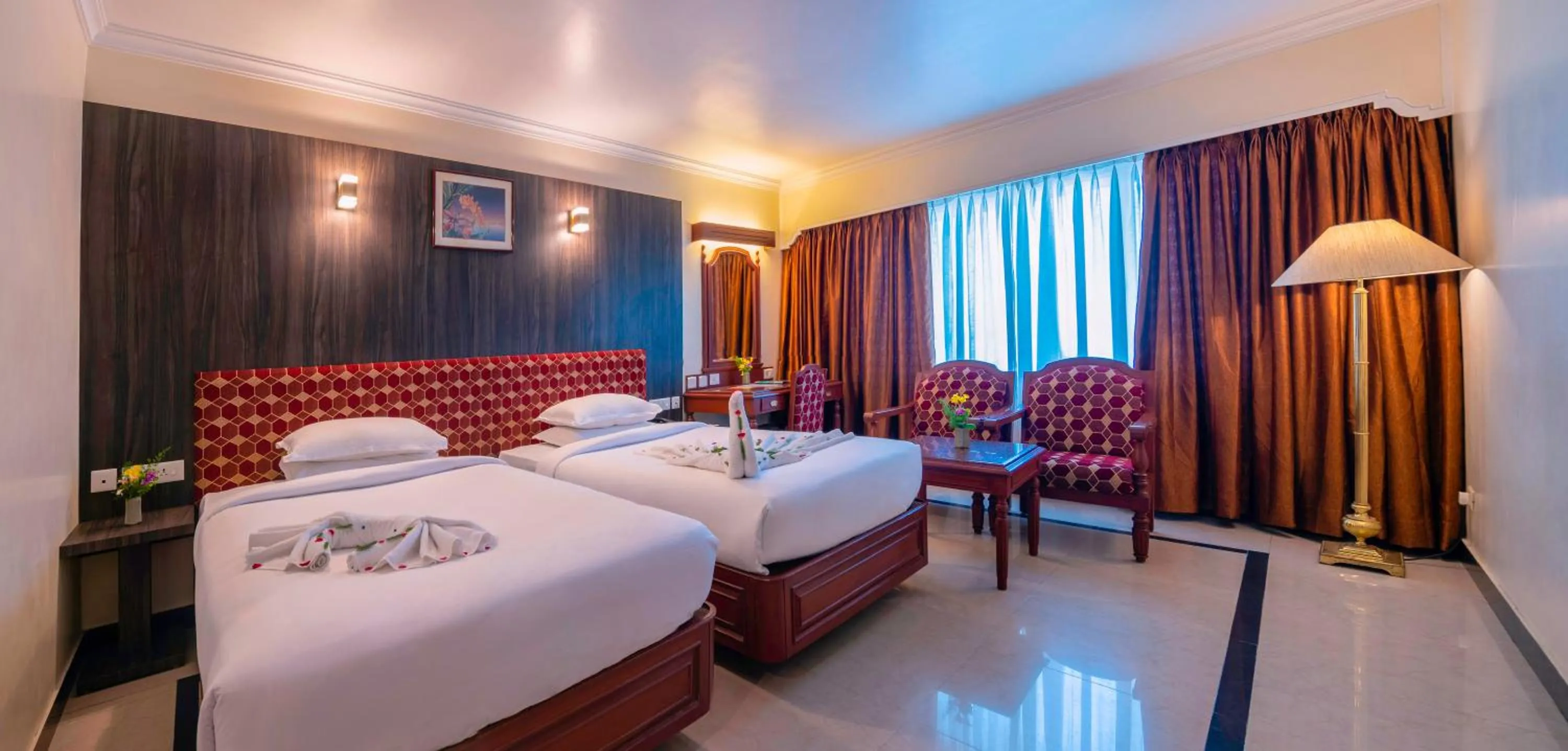 Bed in Hotel Annamalai International