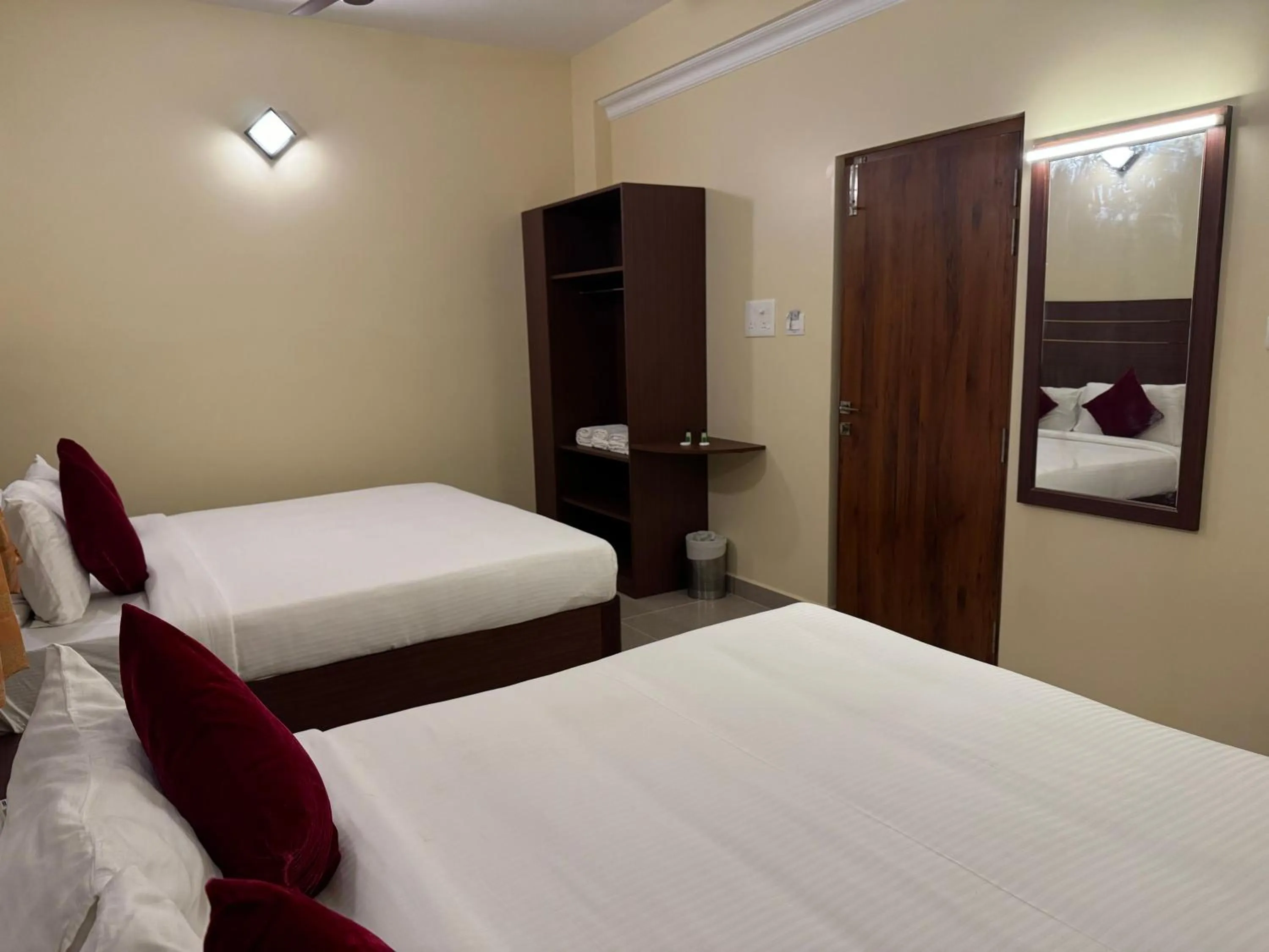 Bed in Hotel Annamalai International