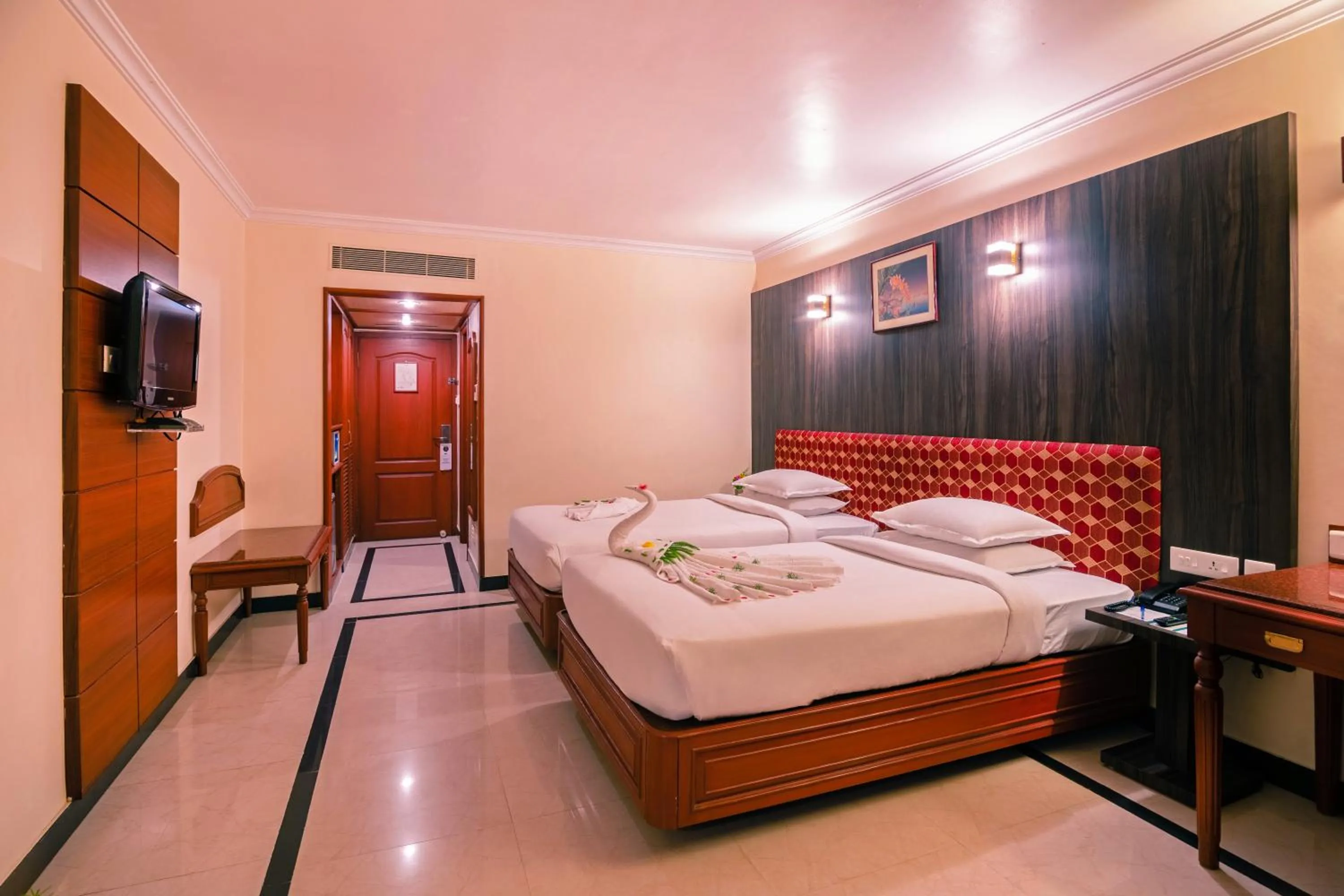 Bed in Hotel Annamalai International