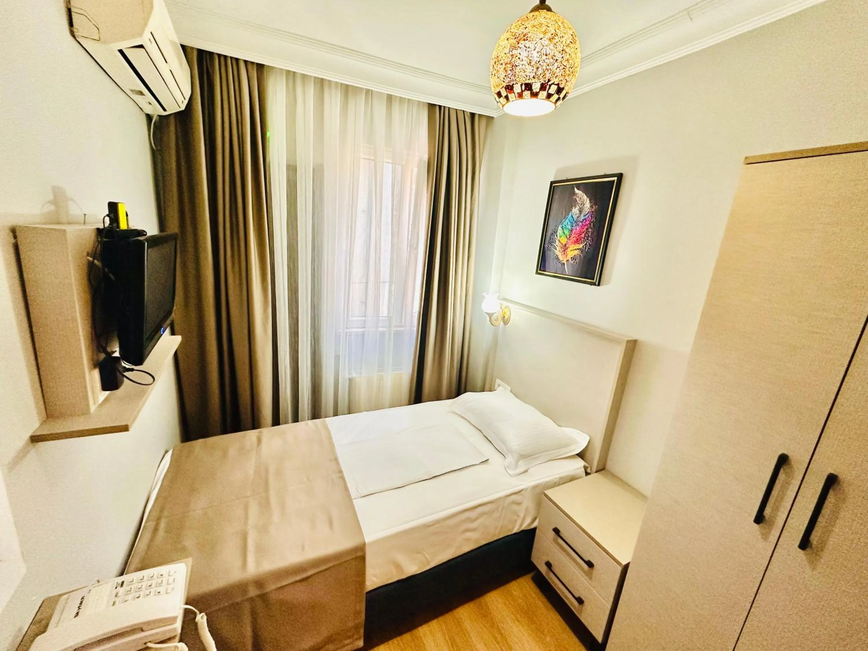 Bed in Crowned Exclusive Hotel