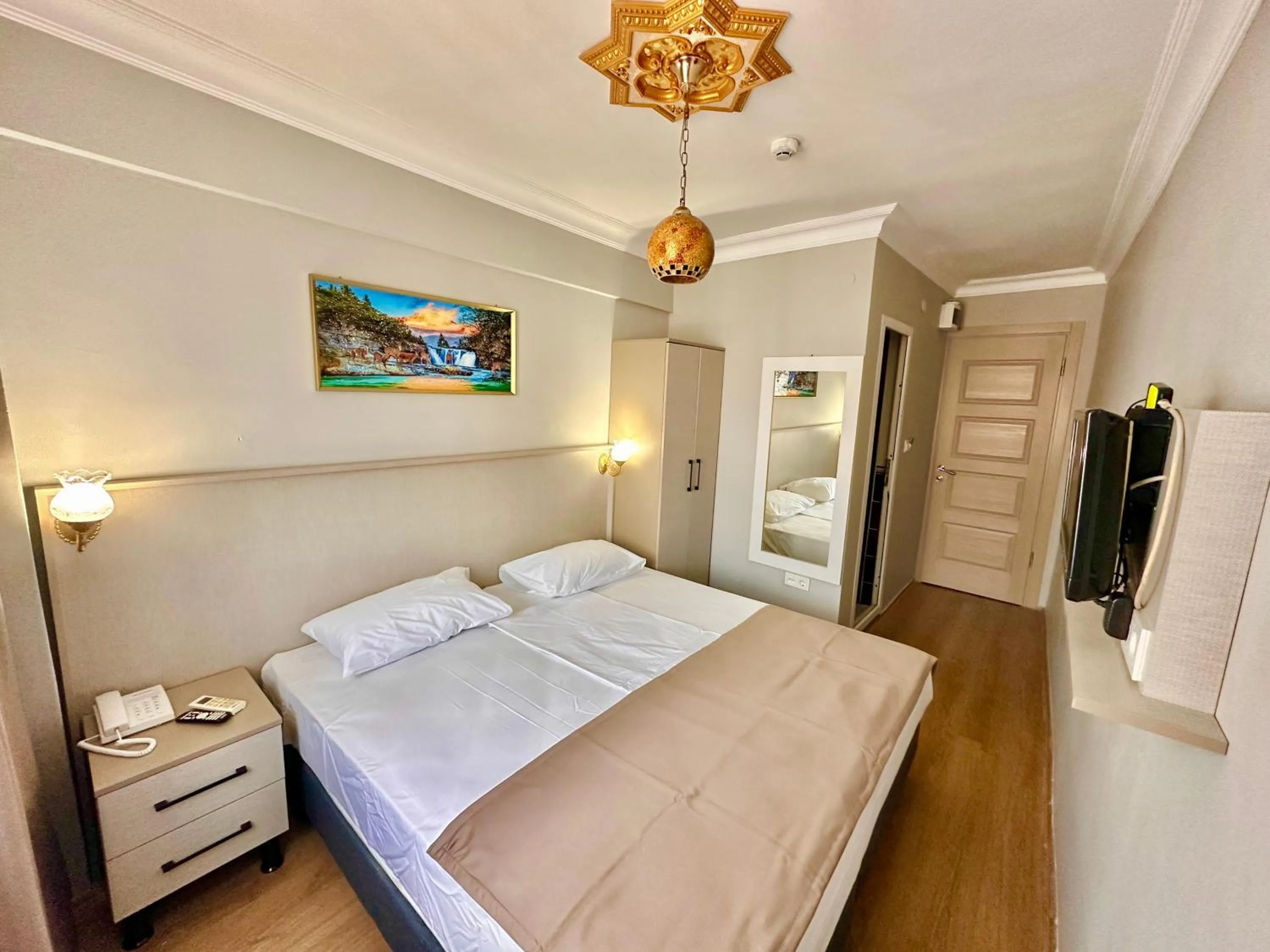 Bed in Crowned Exclusive Hotel