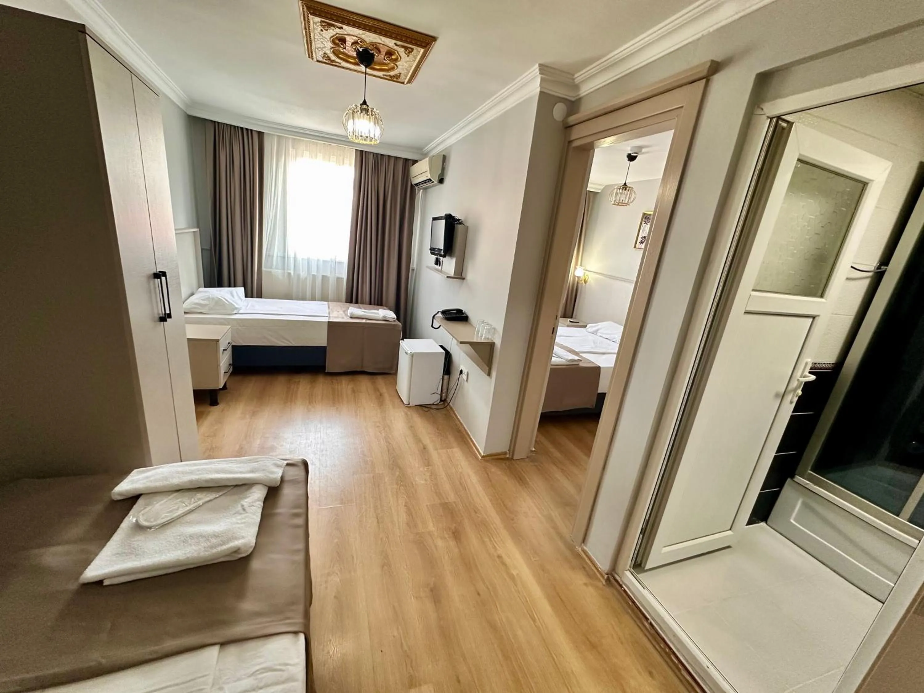 Bed in Crowned Exclusive Hotel