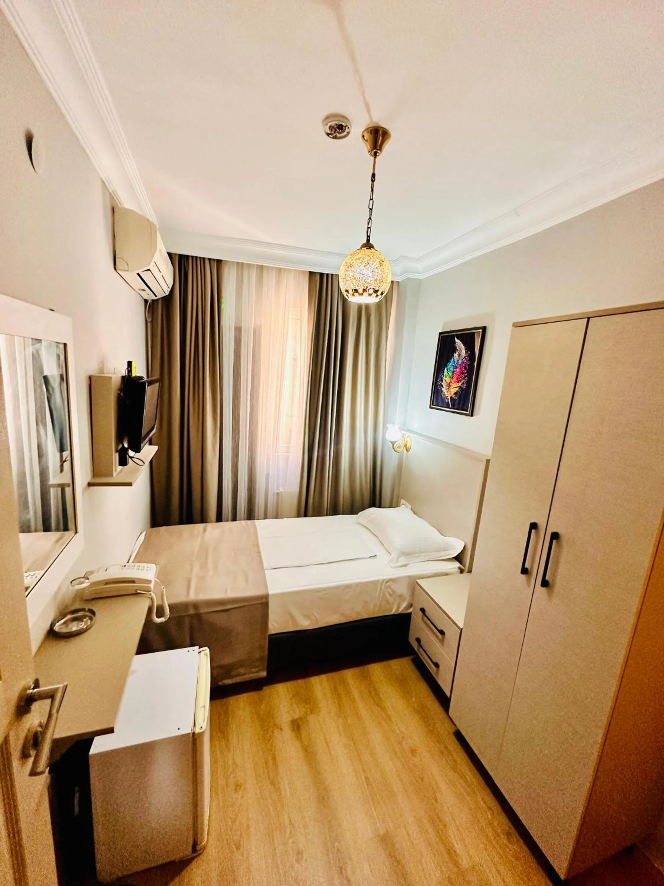 Bed in Crowned Exclusive Hotel