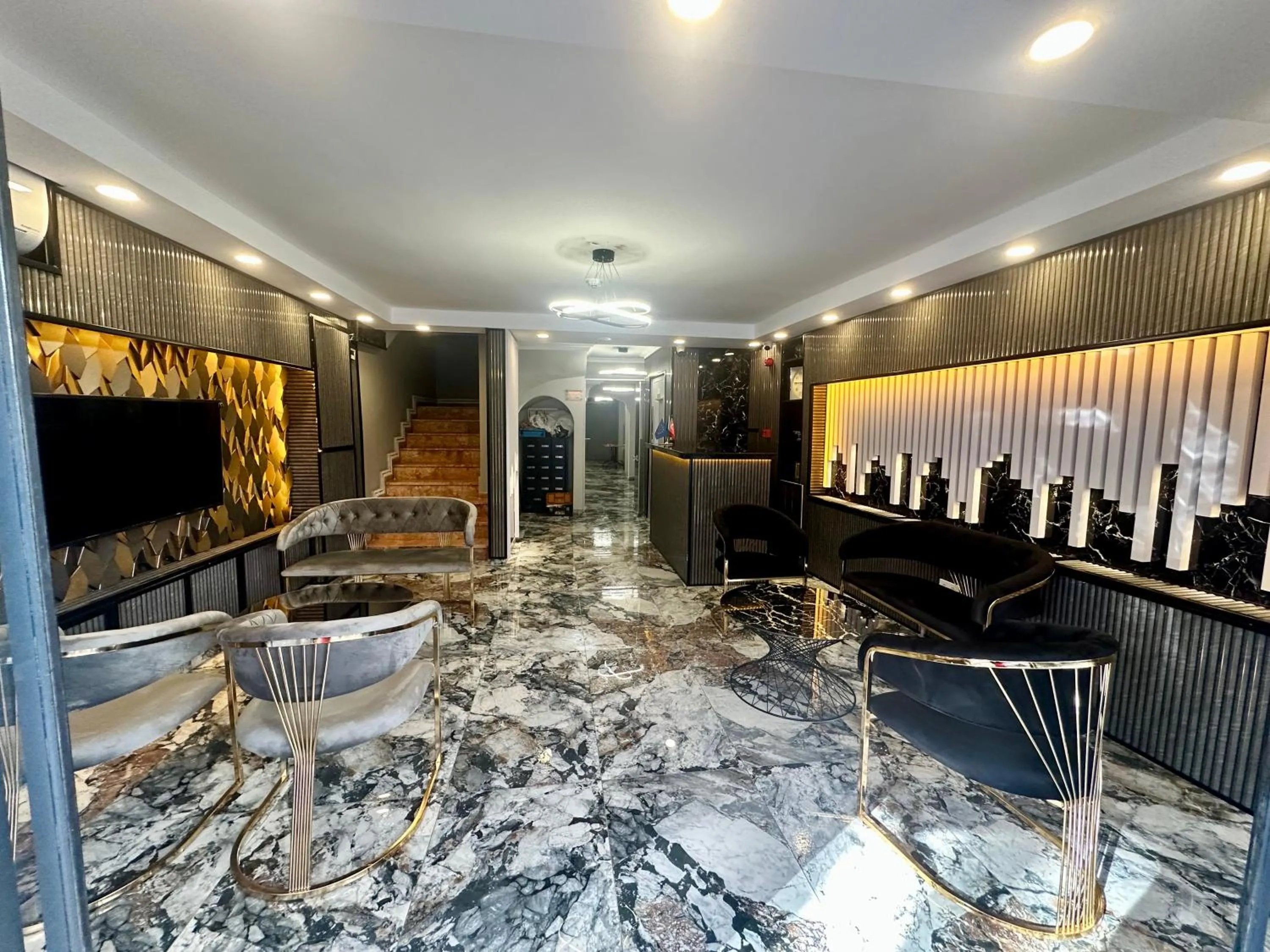 Communal lounge/ TV room in Crowned Exclusive Hotel