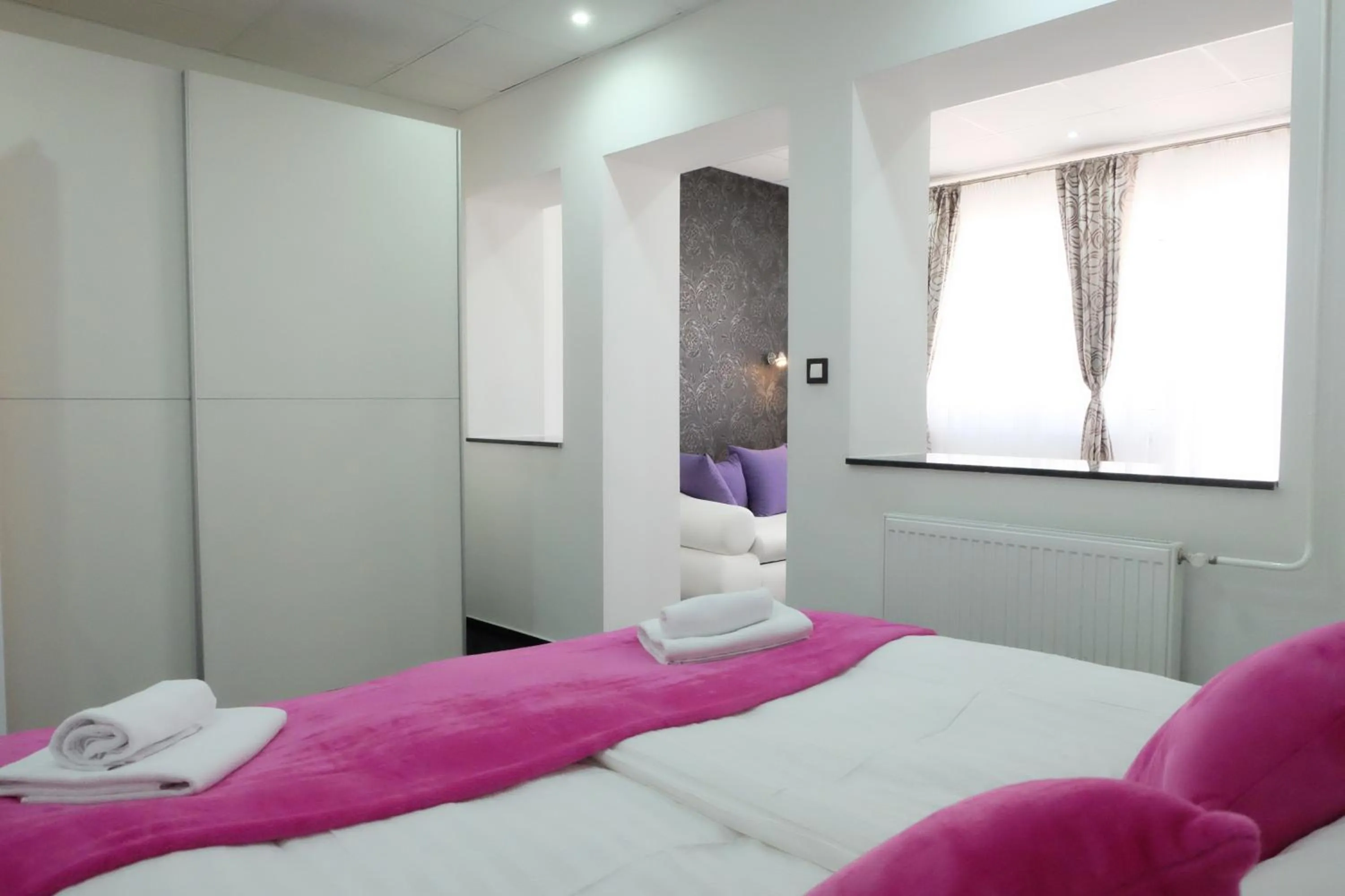 Bed in Luwiana Suites