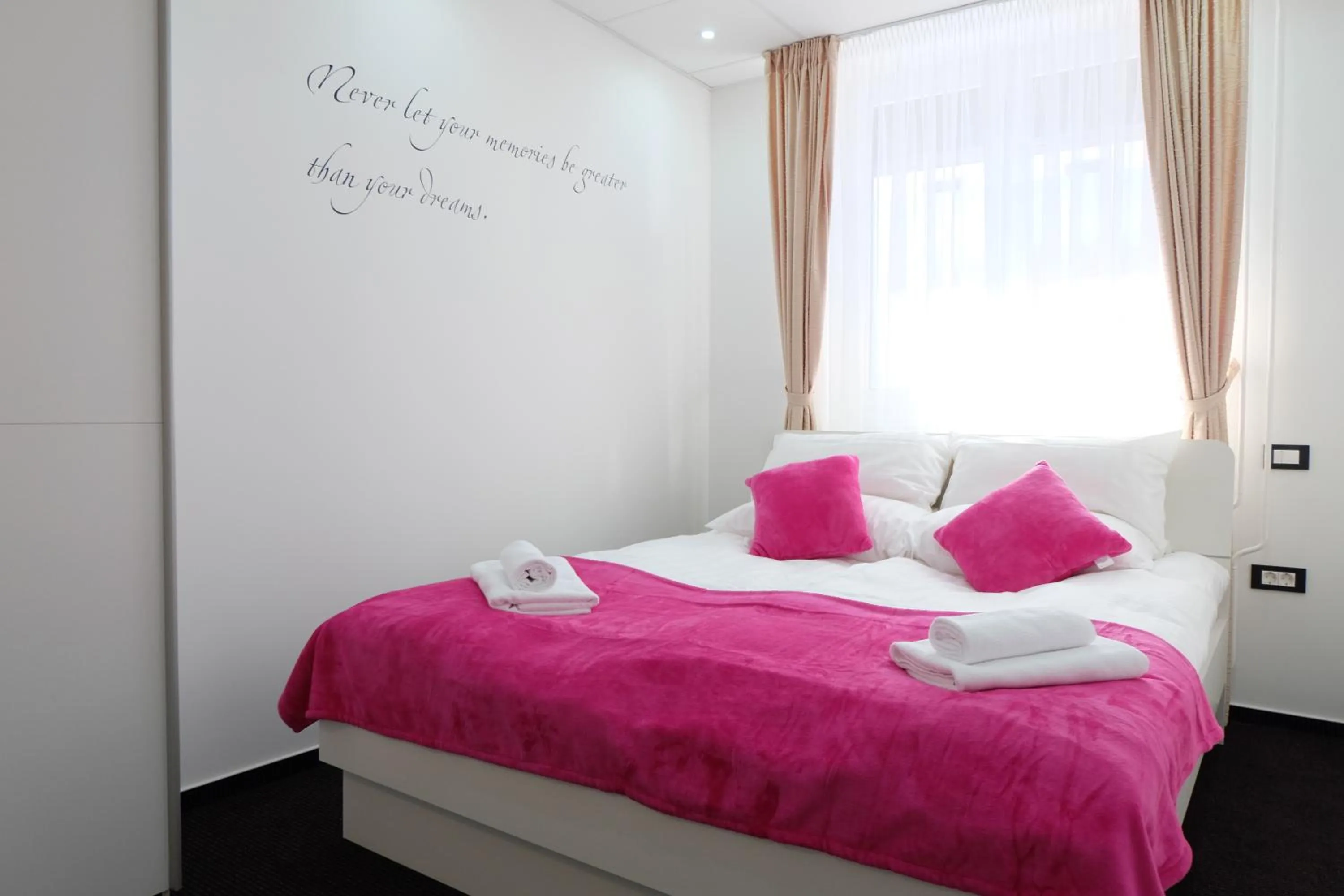 Bed in Luwiana Suites