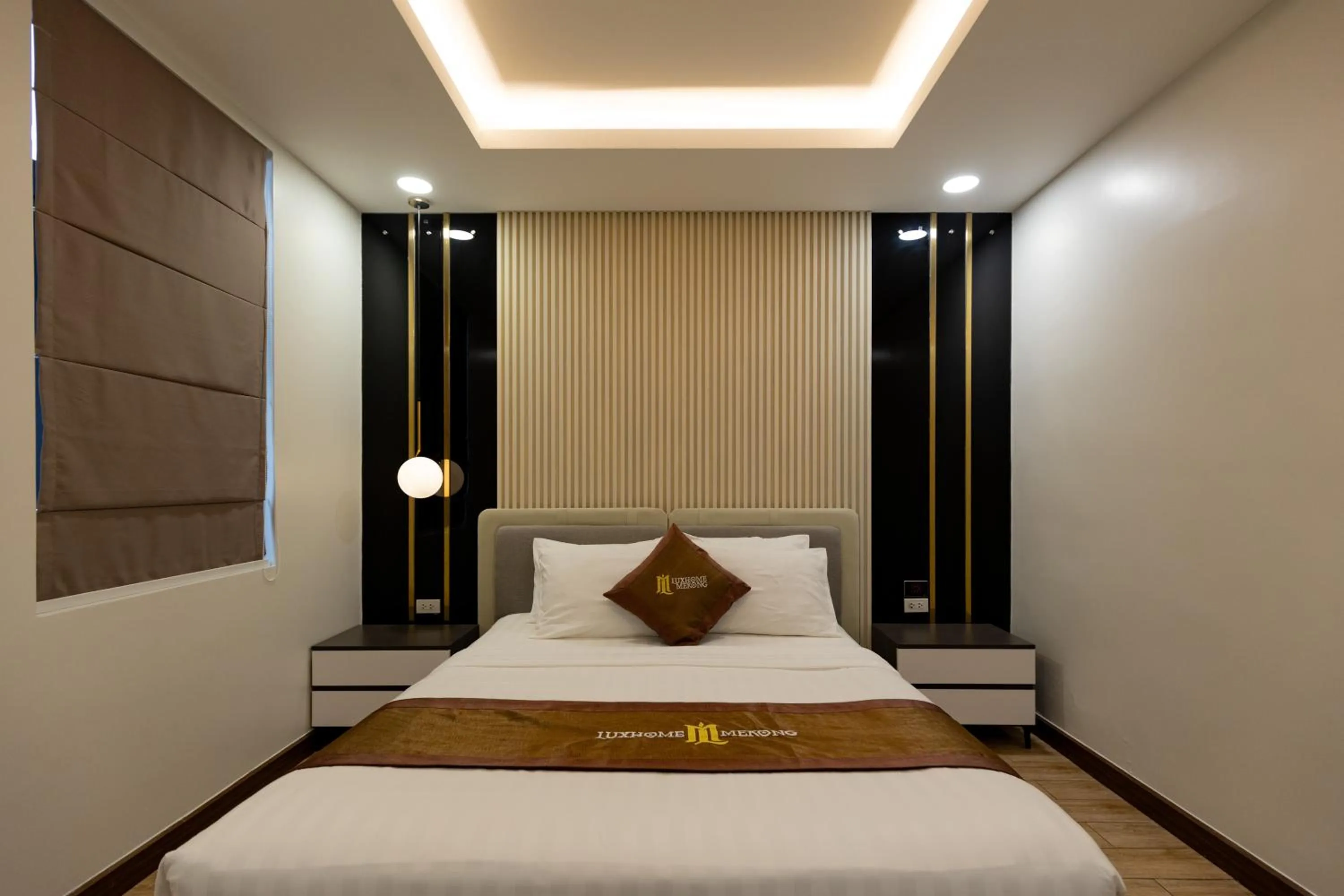 Bed in Luxhome Mekong Hotel