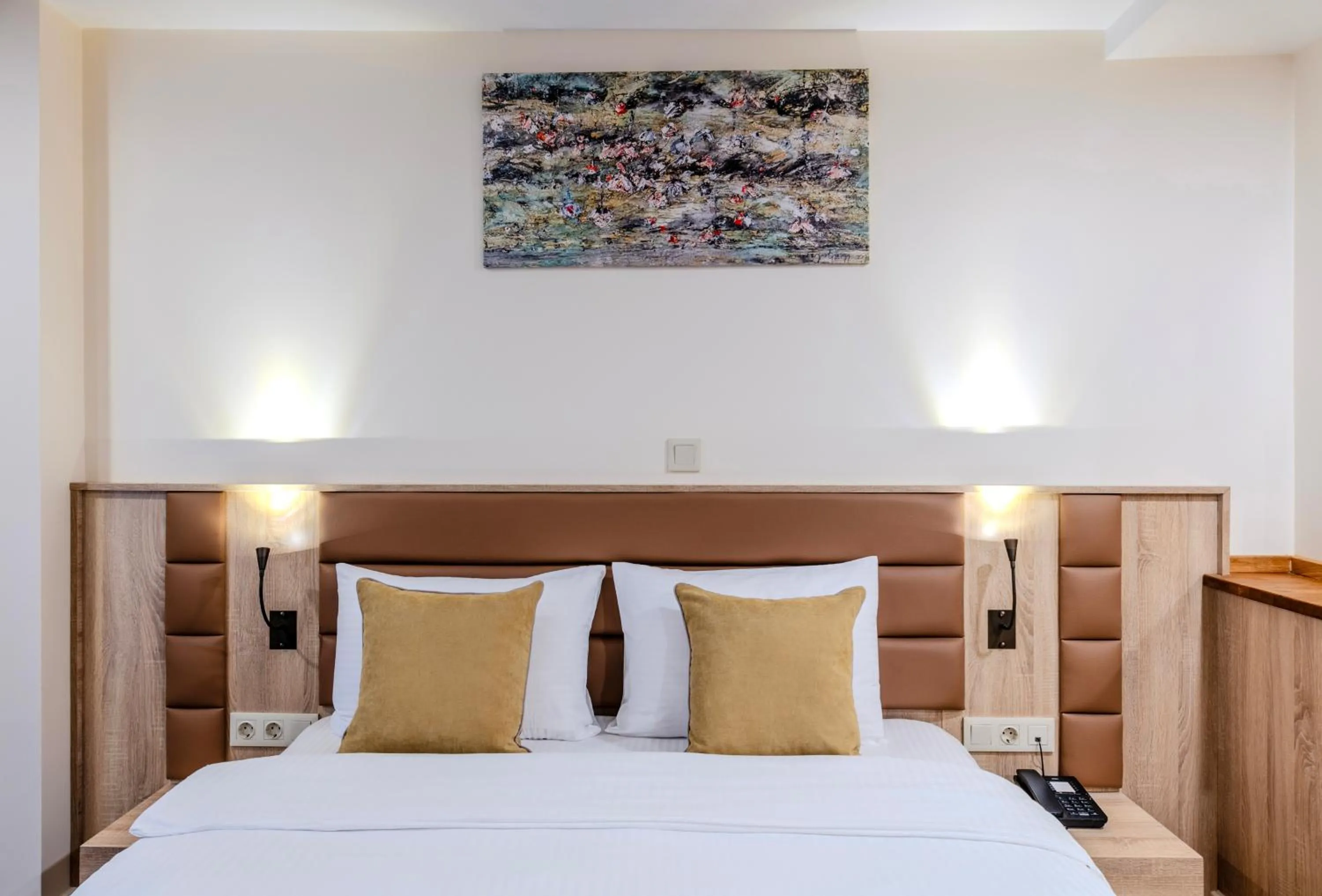 Bed in Roys Hotel & Suites