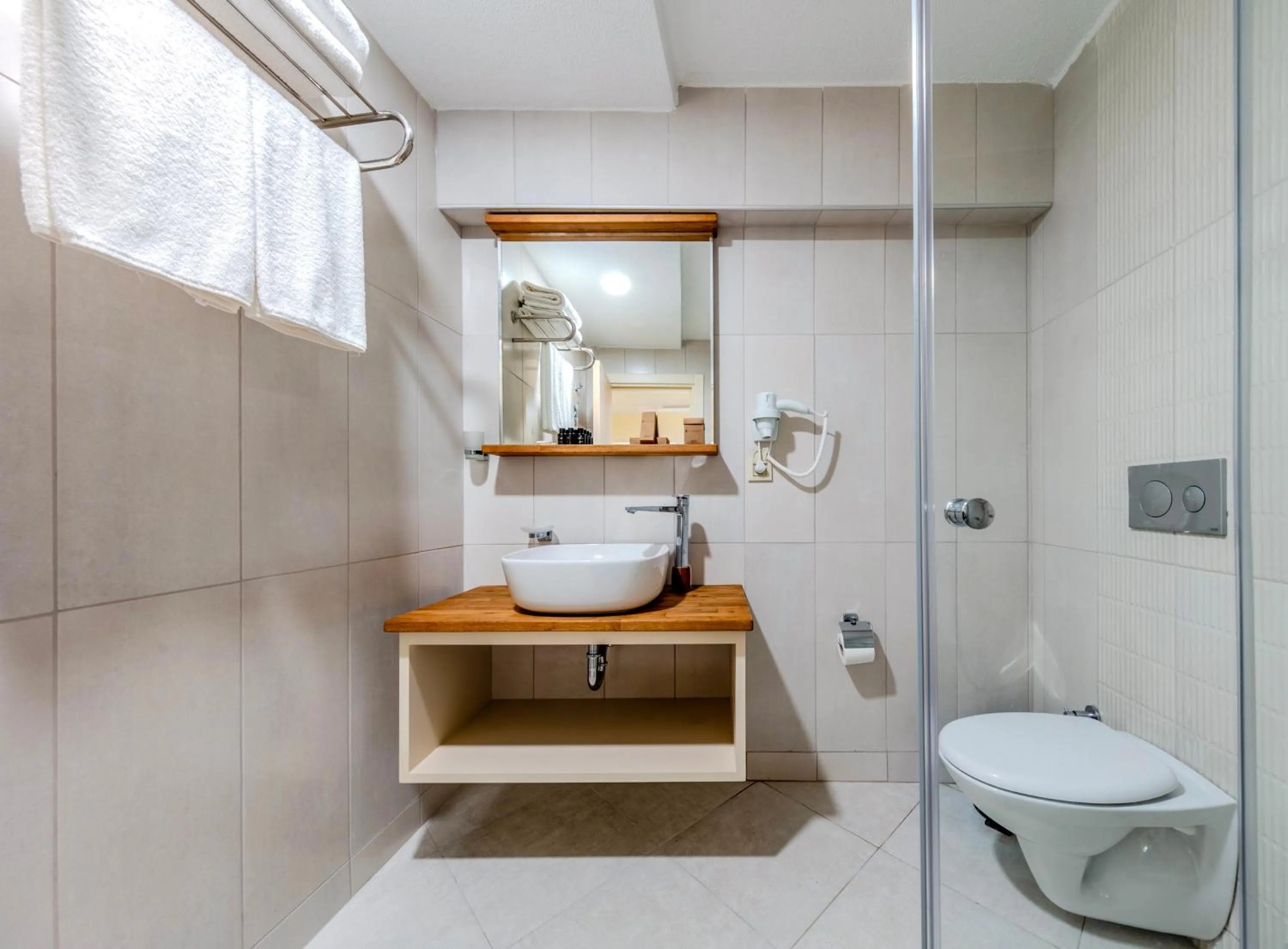 Toilet in Roys Hotel & Suites