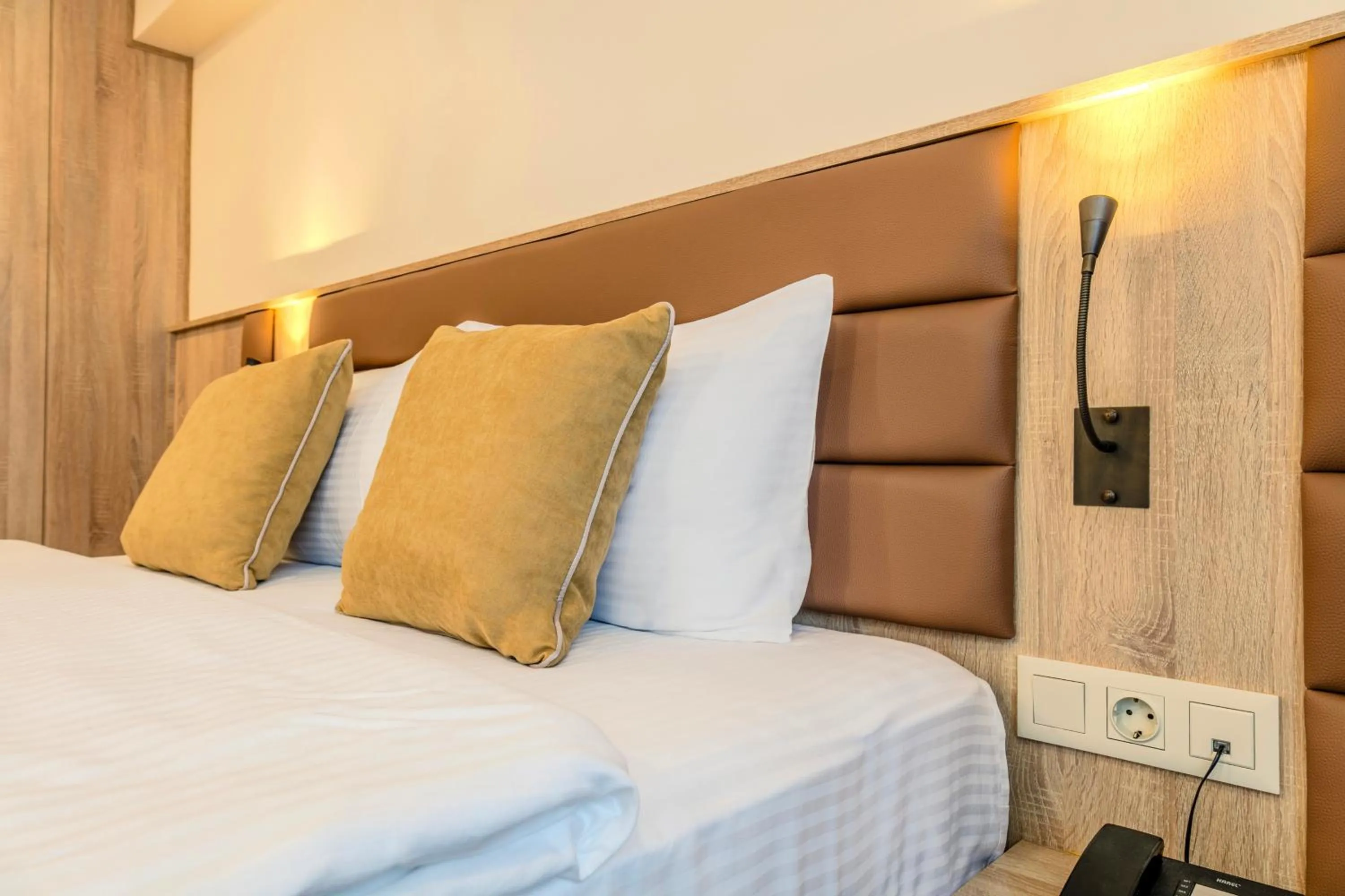 Bed in Roys Hotel & Suites