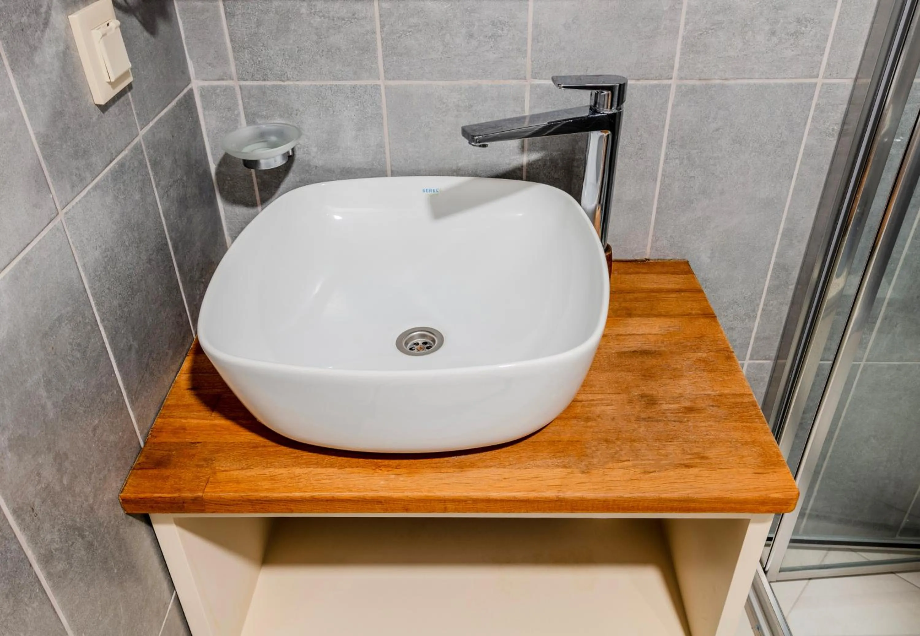 Bathroom in Roys Hotel & Suites