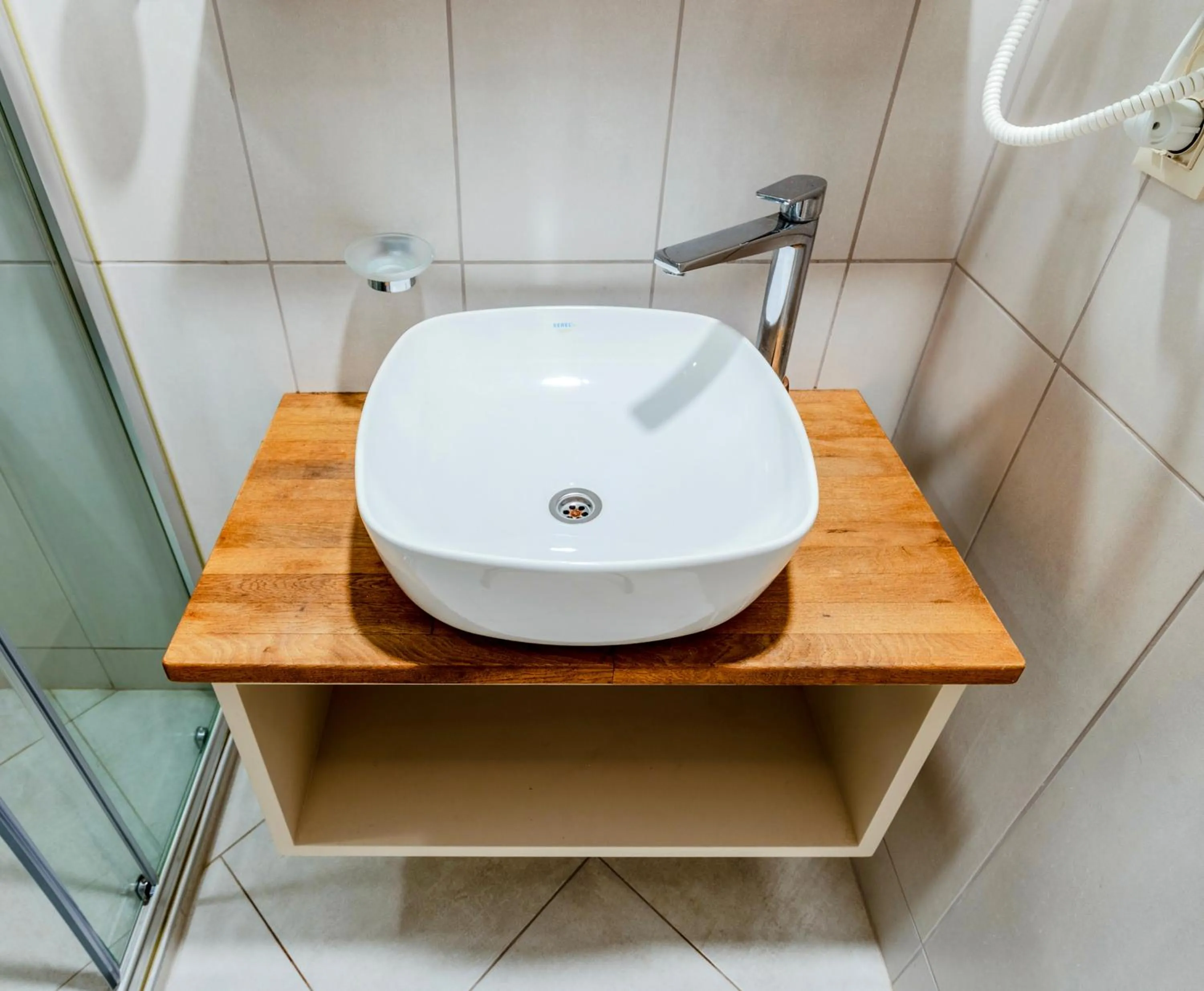 Bathroom in Roys Hotel & Suites