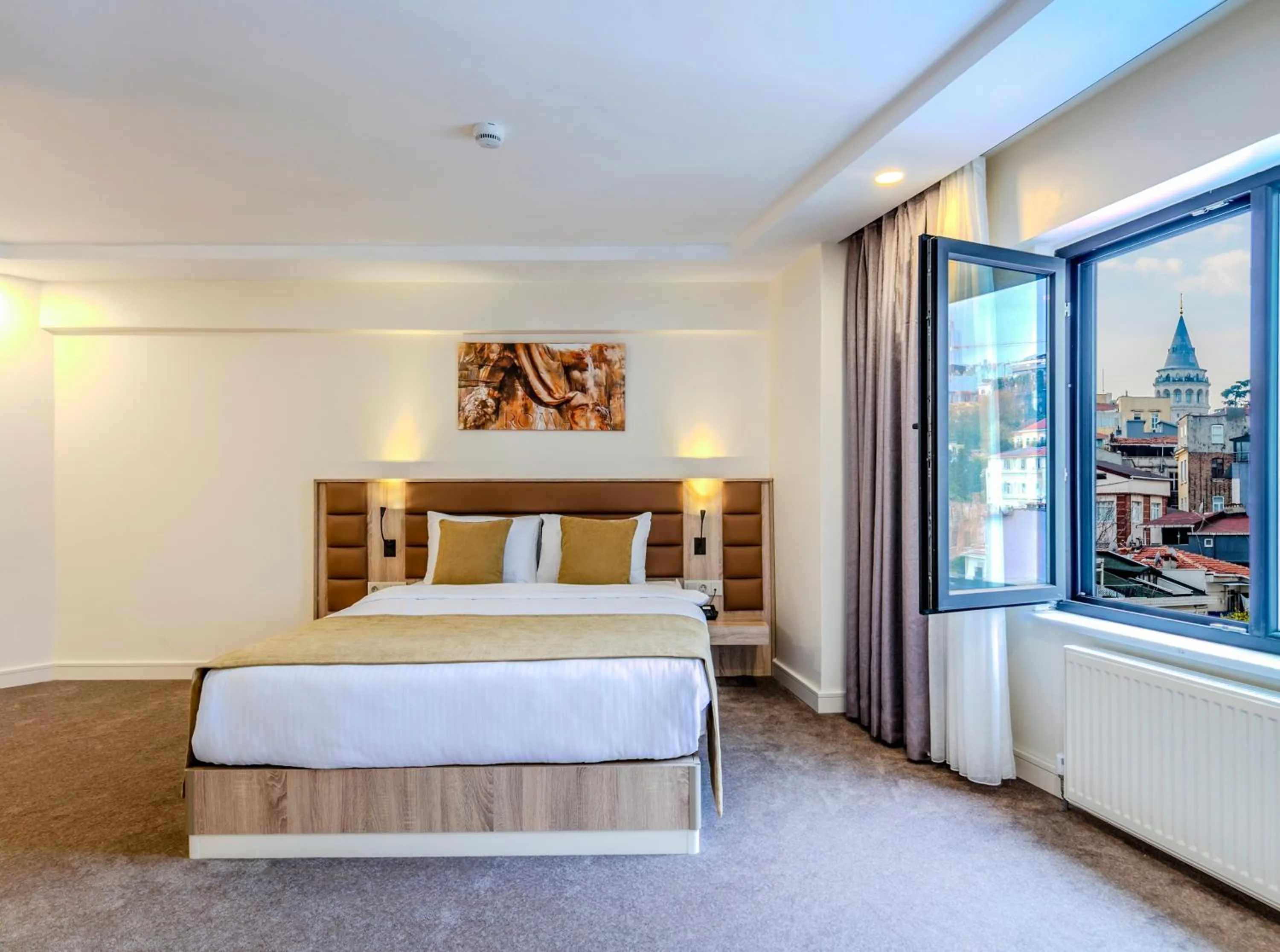 Bed in Roys Hotel & Suites