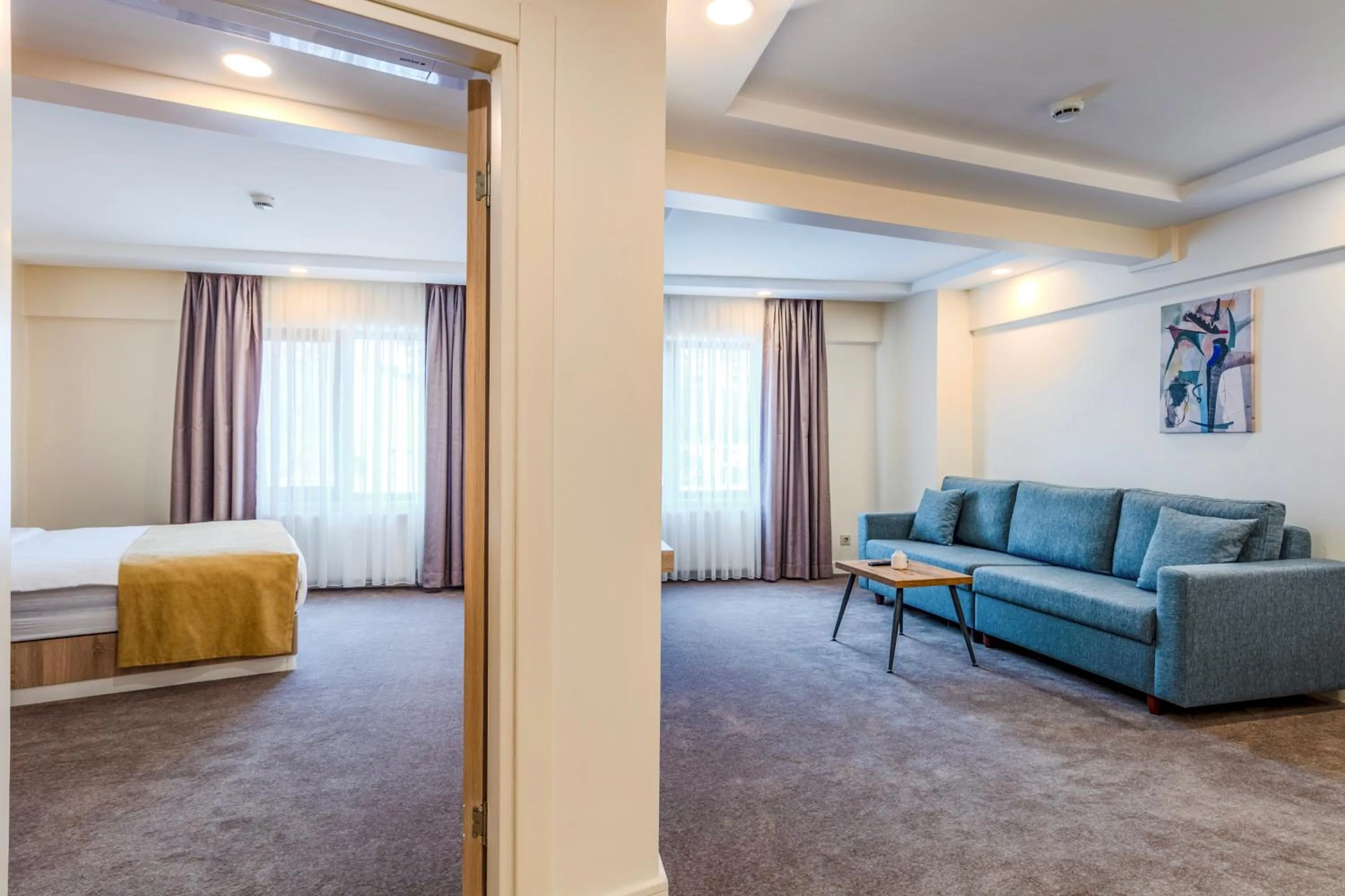 Bed in Roys Hotel & Suites