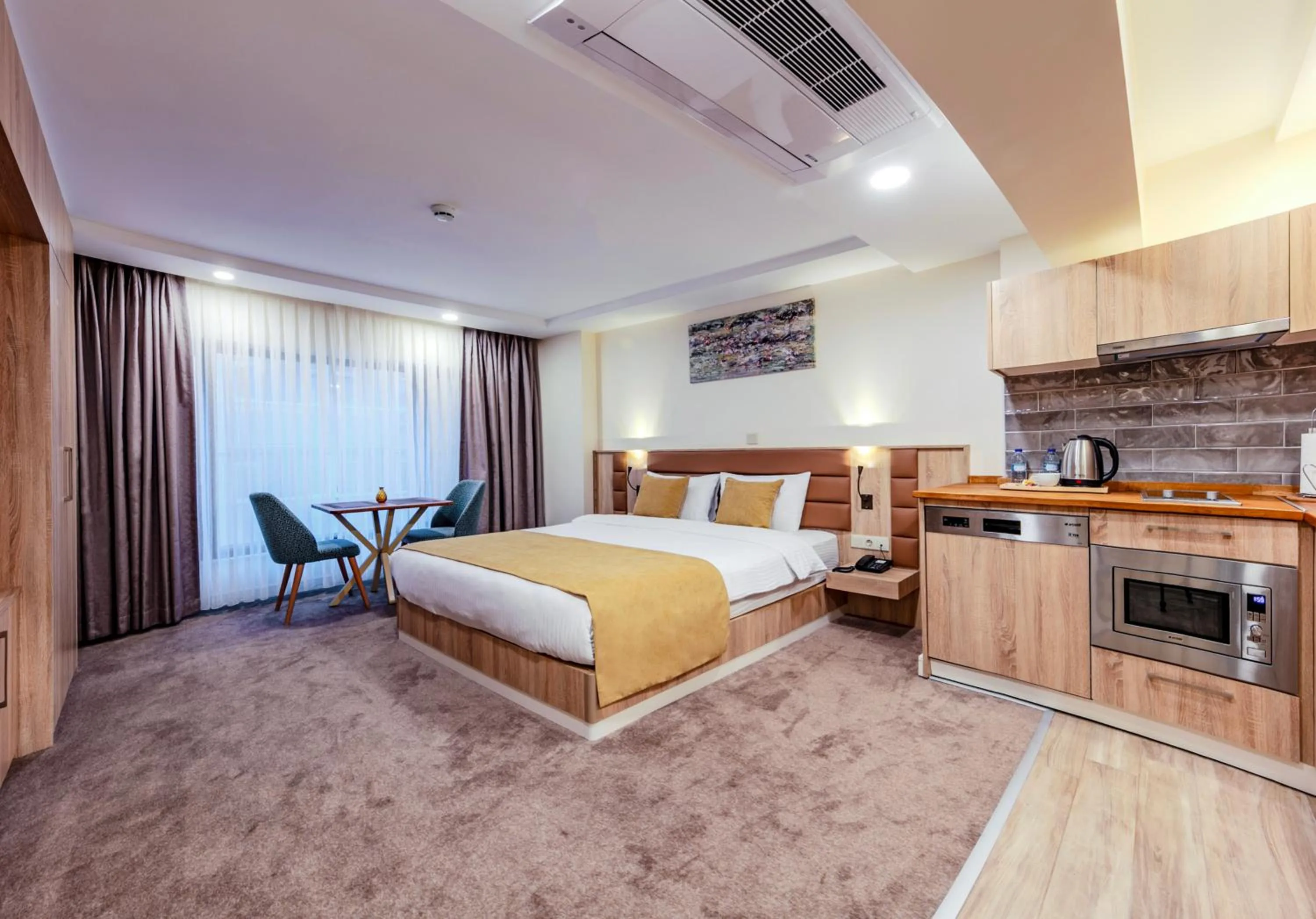 Bed in Roys Hotel & Suites