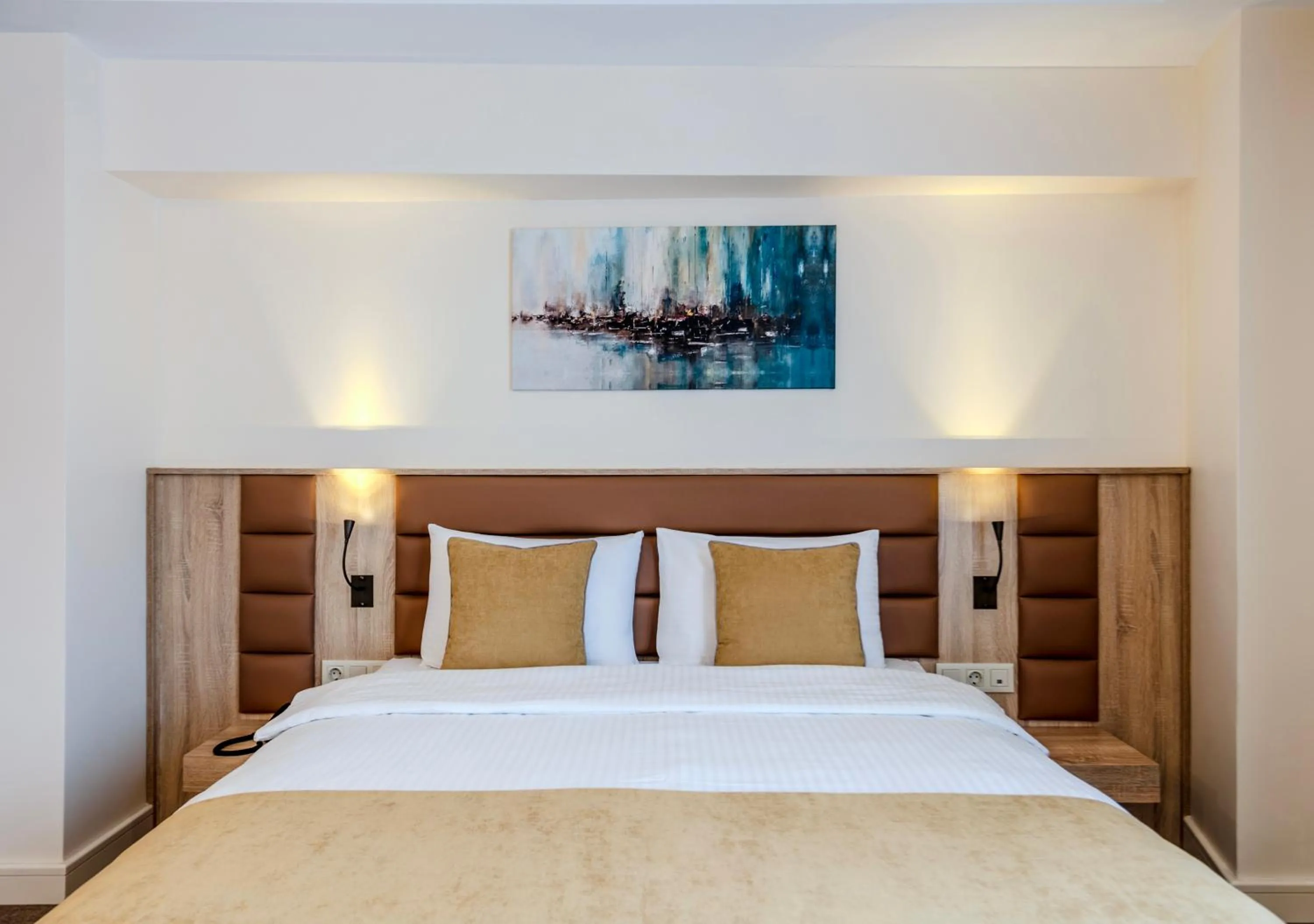 Bed in Roys Hotel & Suites