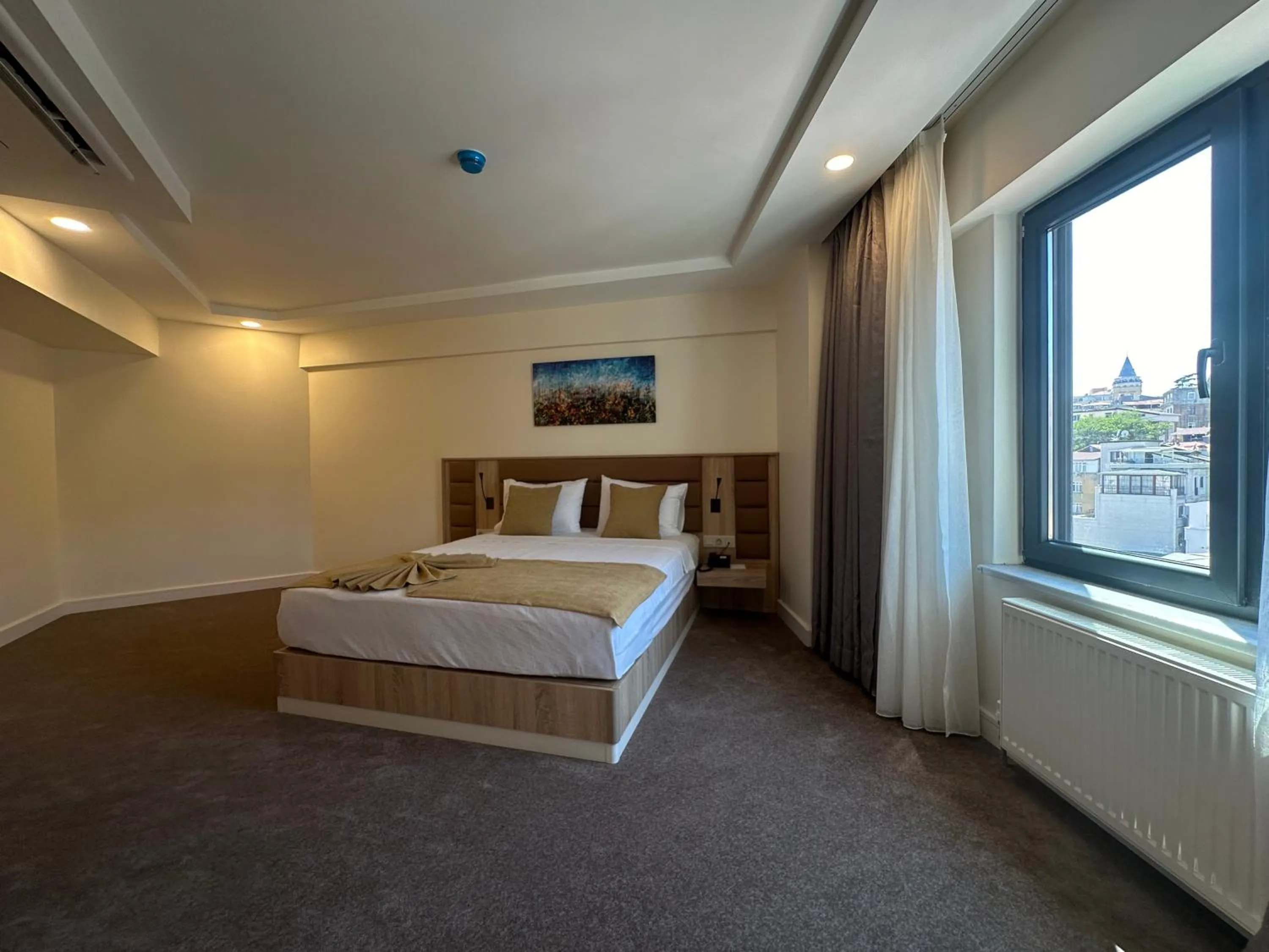 Bed in Roys Hotel & Suites