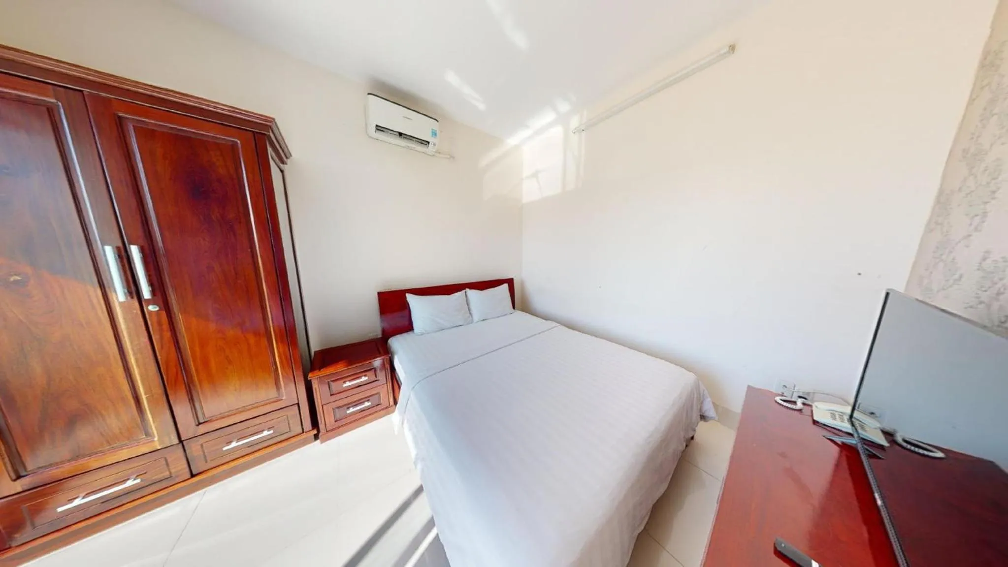 Bed in Lotus Apartment Hotel