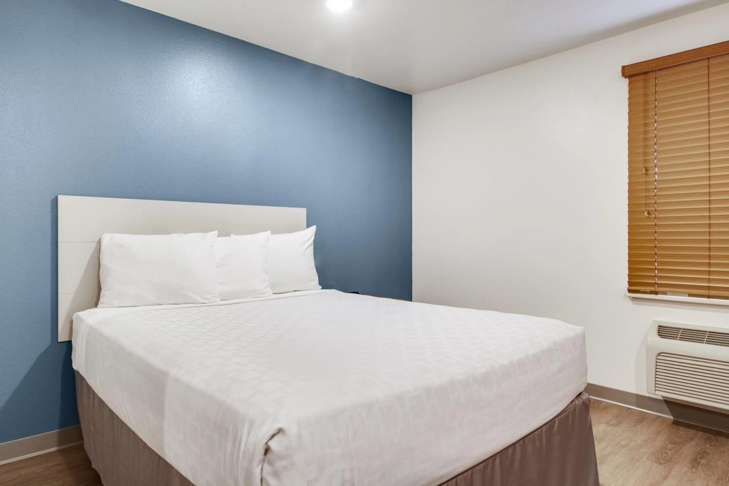 Bed in WoodSpring Suites Houston Westchase