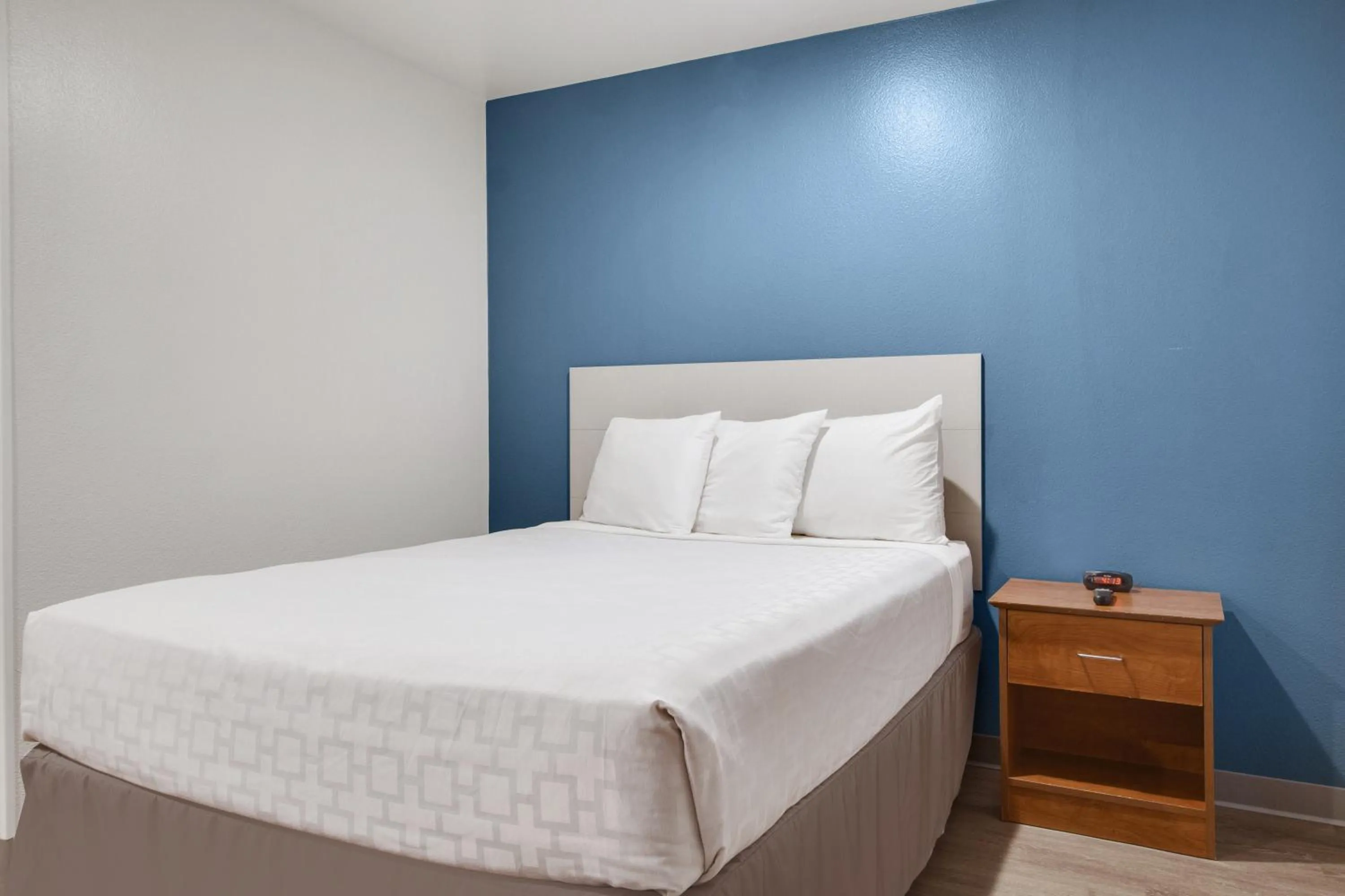 Bed in WoodSpring Suites Houston Westchase