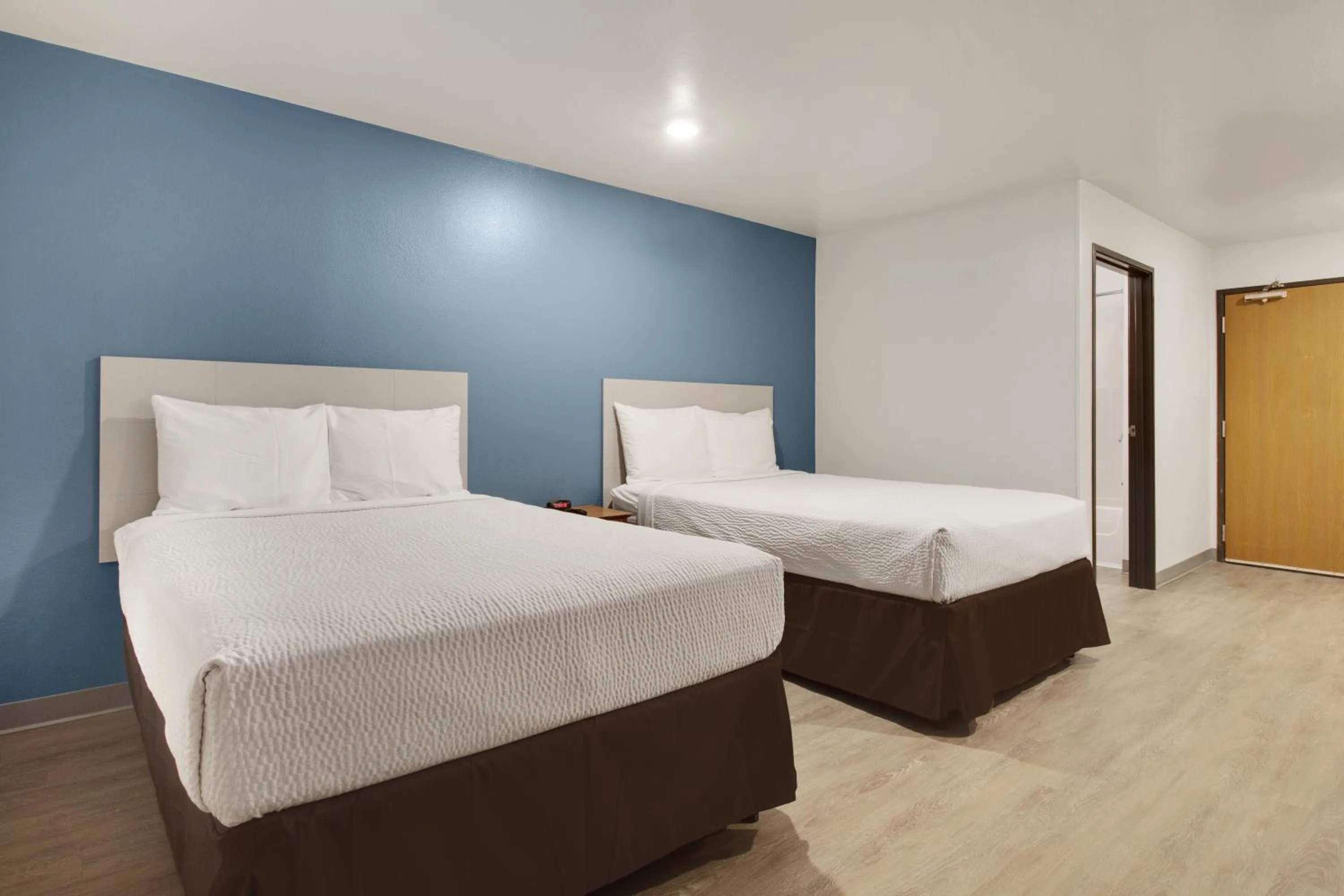 Bed in WoodSpring Suites Houston Willowbrook