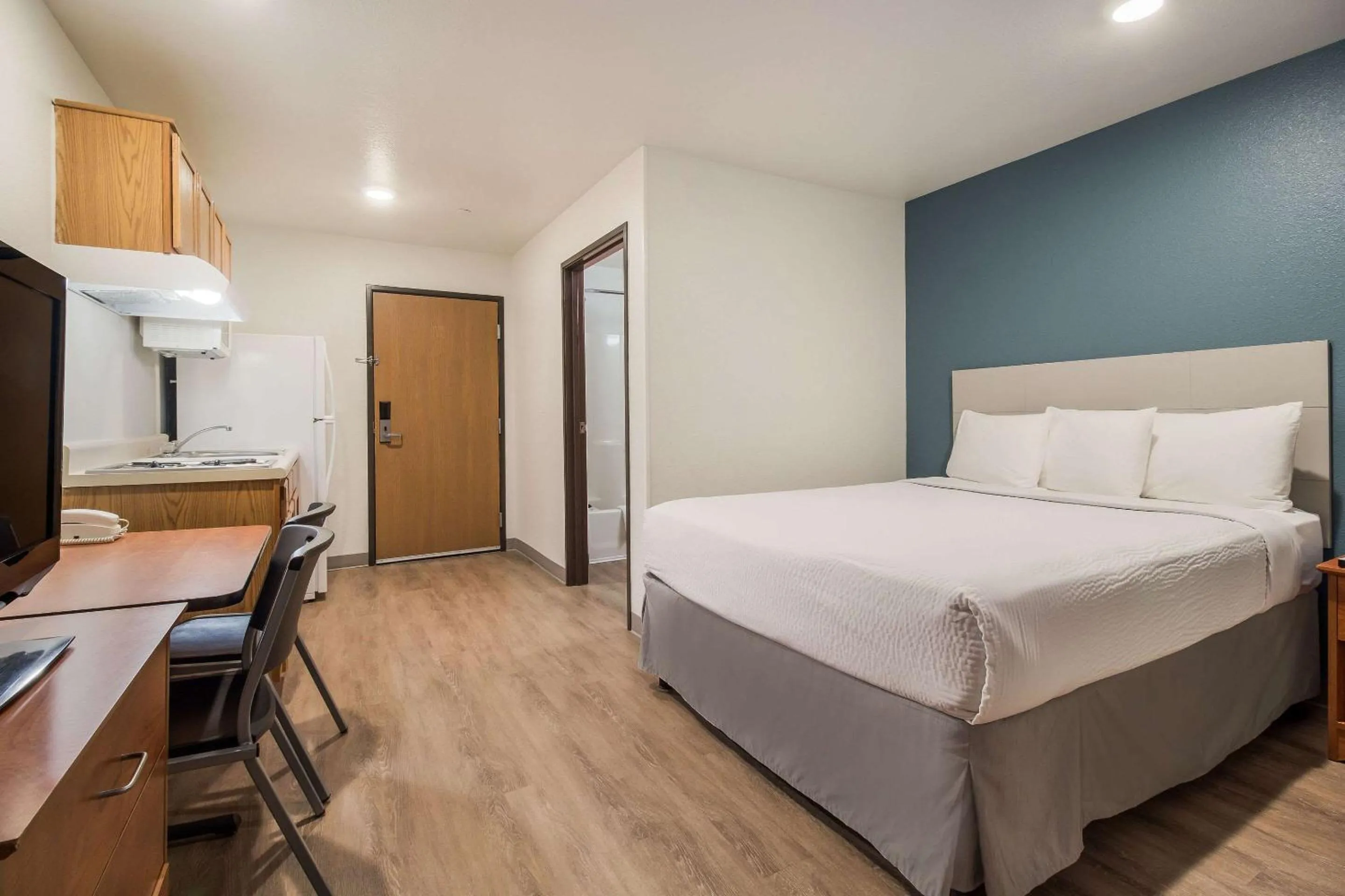 Photo of the whole room, Bed in WoodSpring Suites Houston La Porte