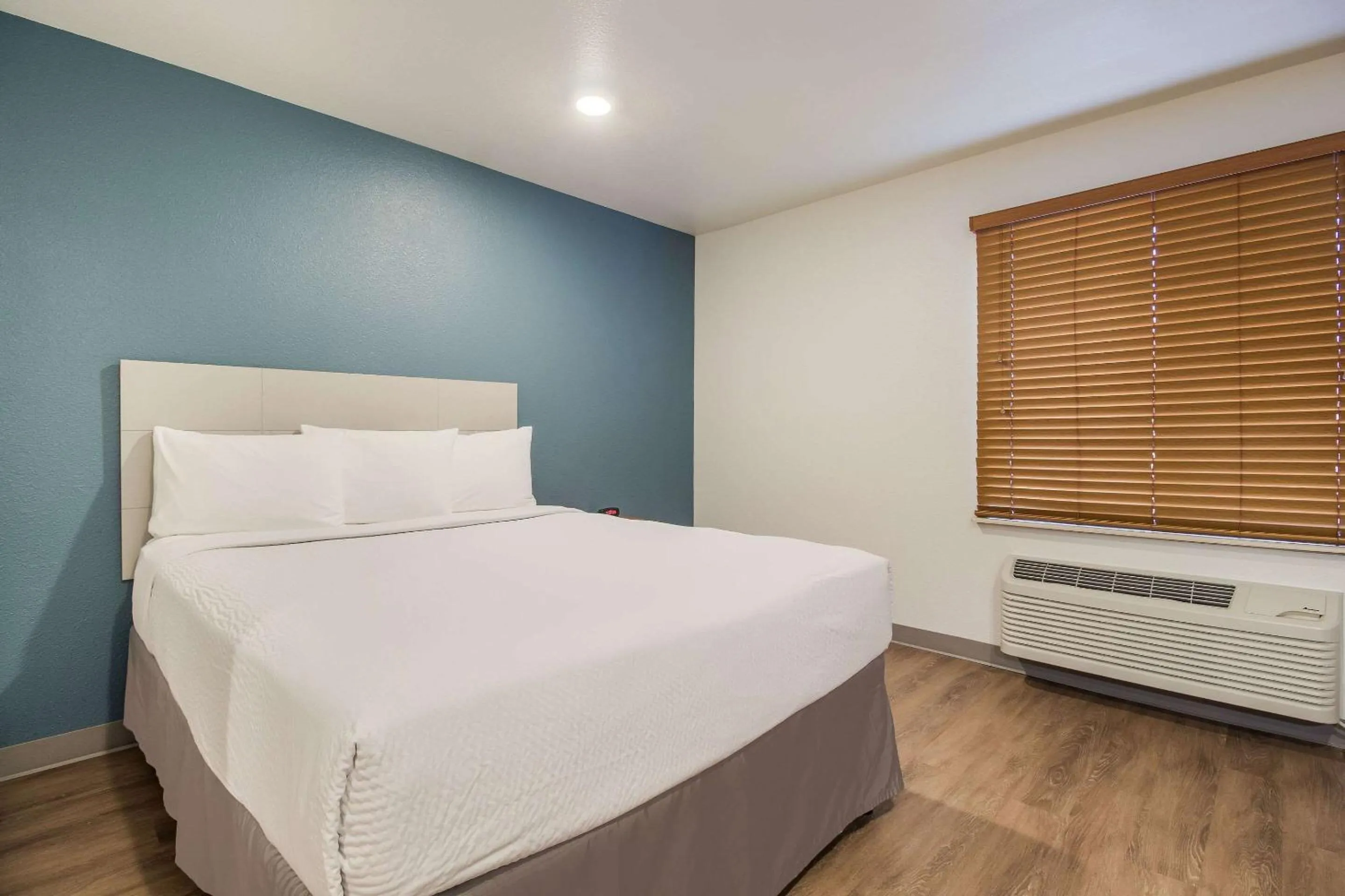 Photo of the whole room, Bed in WoodSpring Suites Houston La Porte