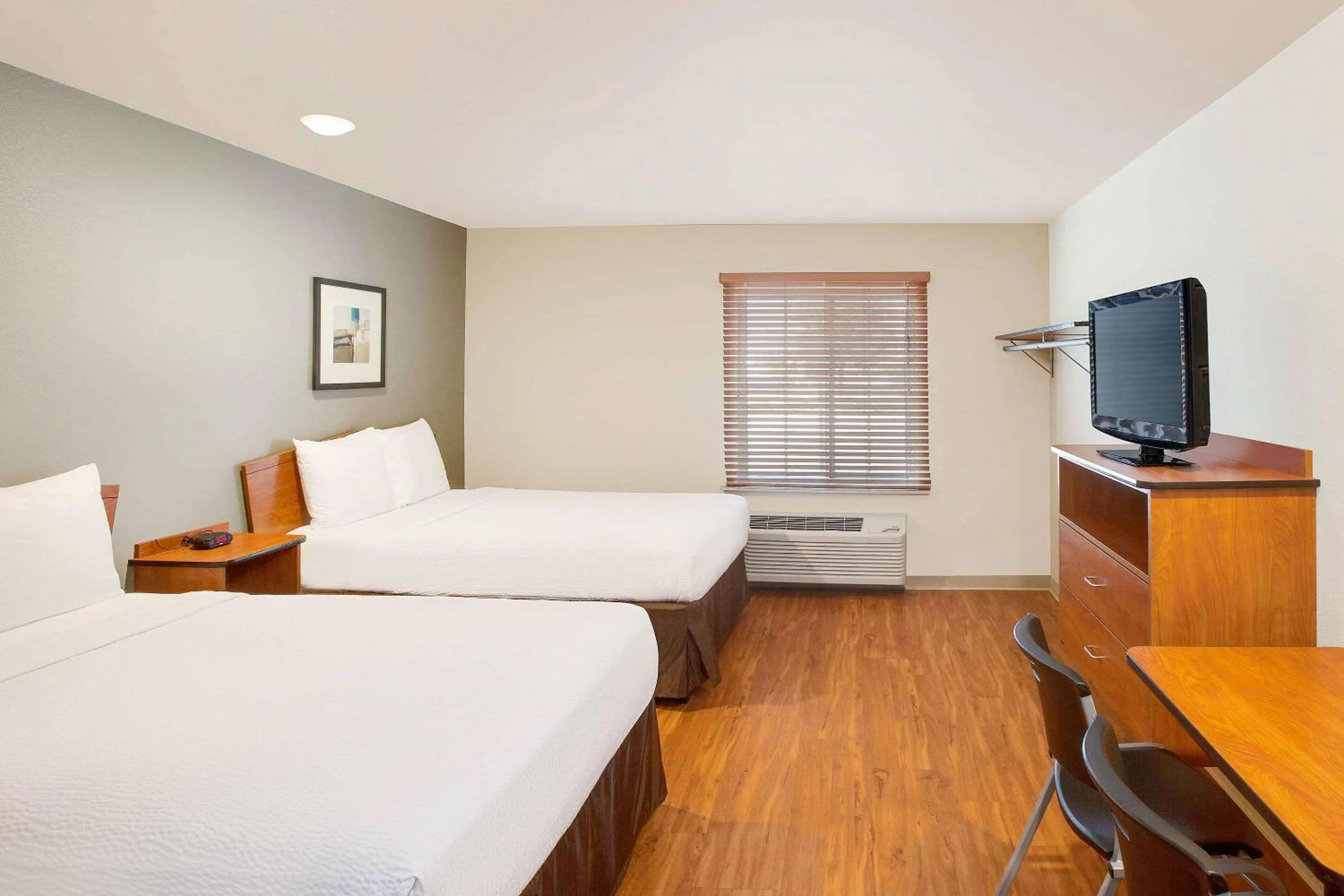 Photo of the whole room, Bed in WoodSpring Suites College Station
