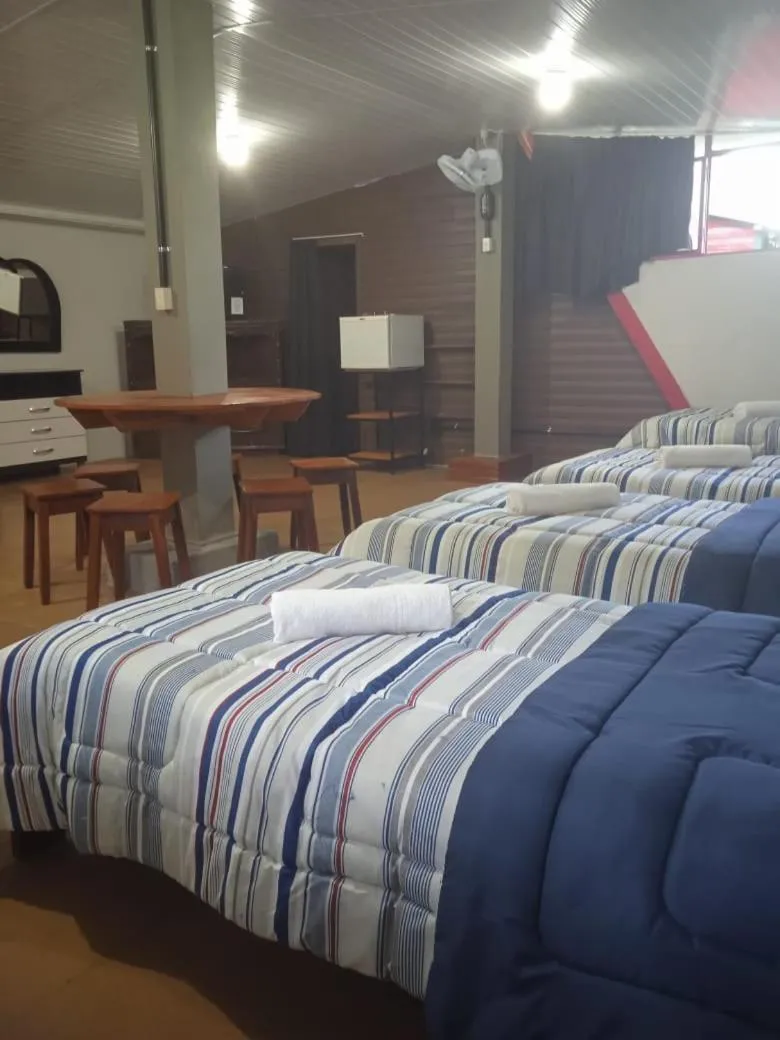 Bed in Pousada Chale Pico da Bandeira