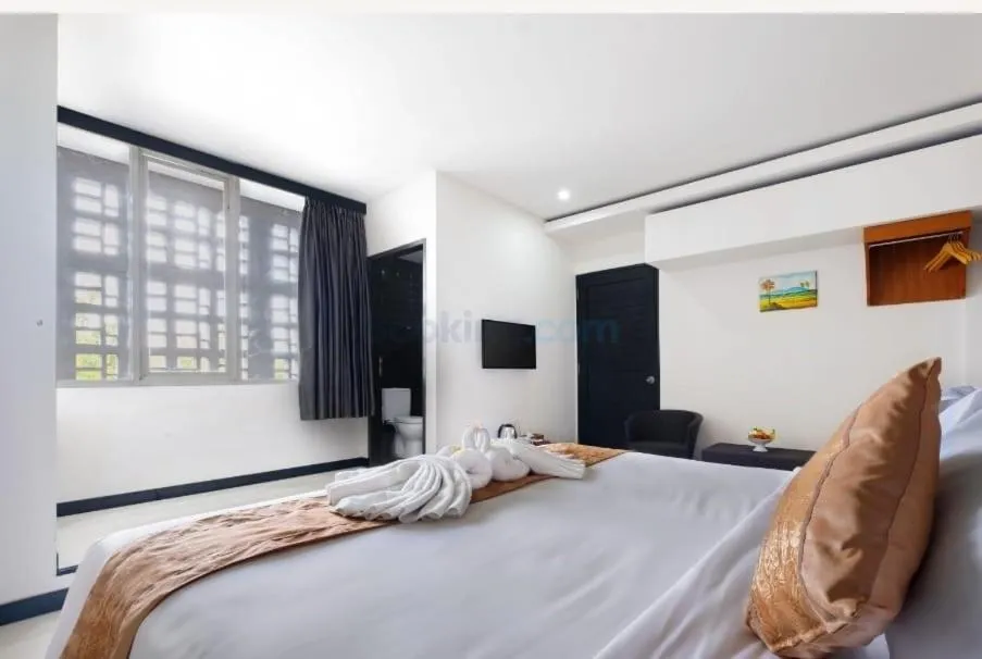 Bed in The Kanjeng Suites Kuta Galeria - Bali