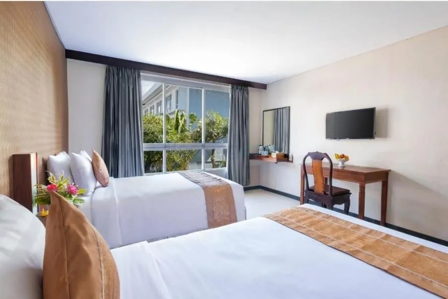 Bed in The Kanjeng Suites Kuta Galeria - Bali