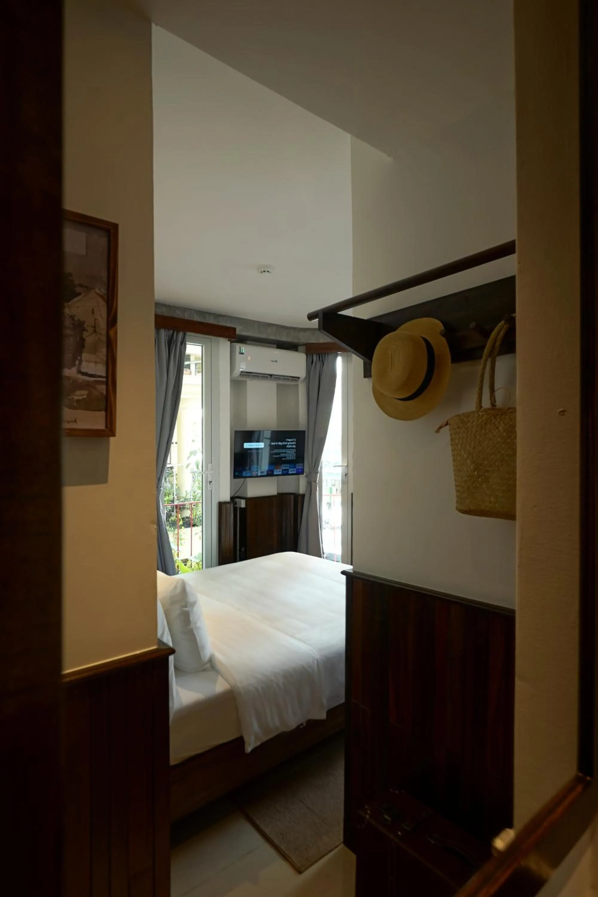 Photo of the whole room, Bed in Nexus House Nguyen Binh Khiem - Near Saigon Zoo & Botanical Gardens