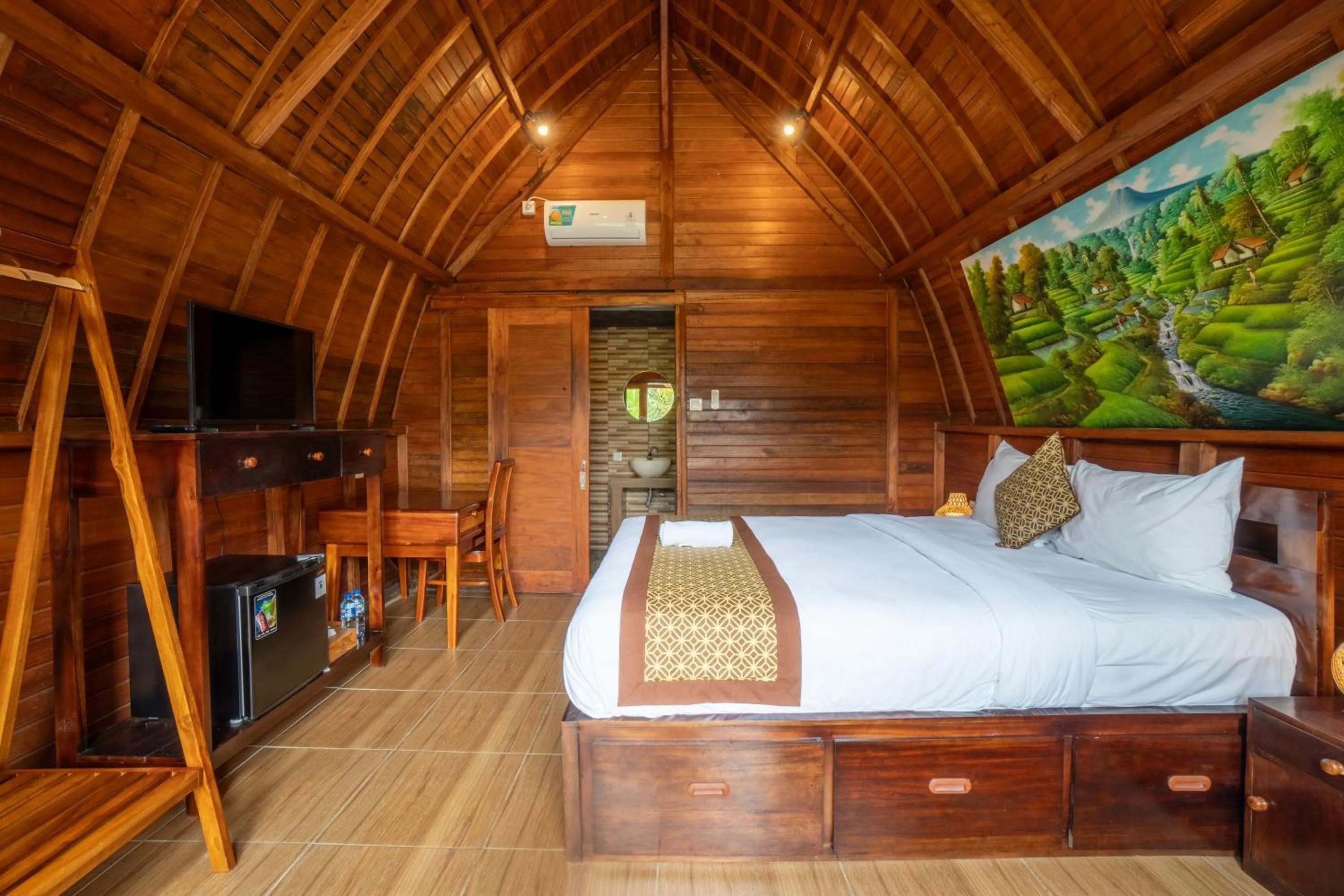 Communal lounge/ TV room, Bed in Puri Kurnia Ayu