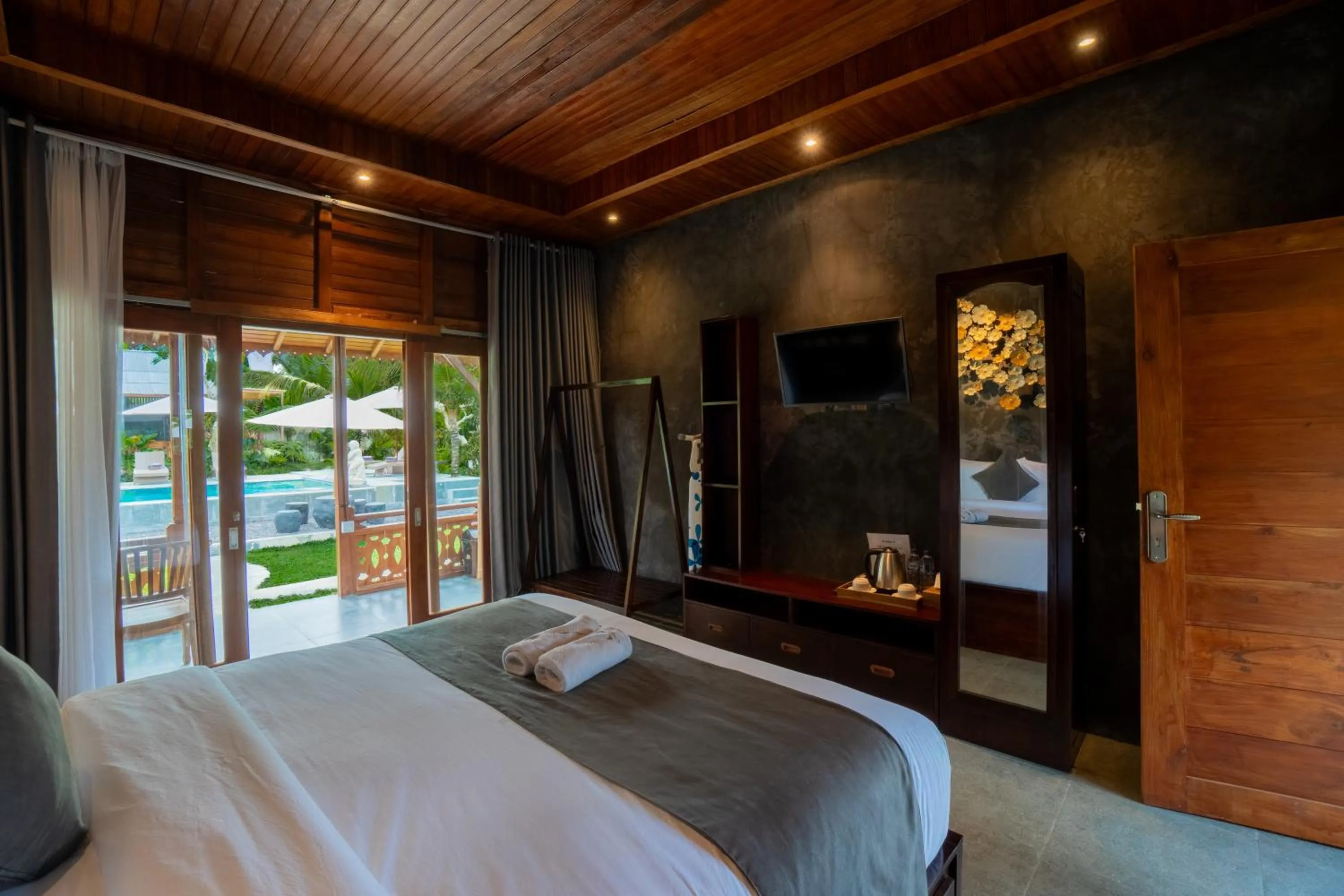 Communal lounge/ TV room, Bed in Puri Kurnia Ayu