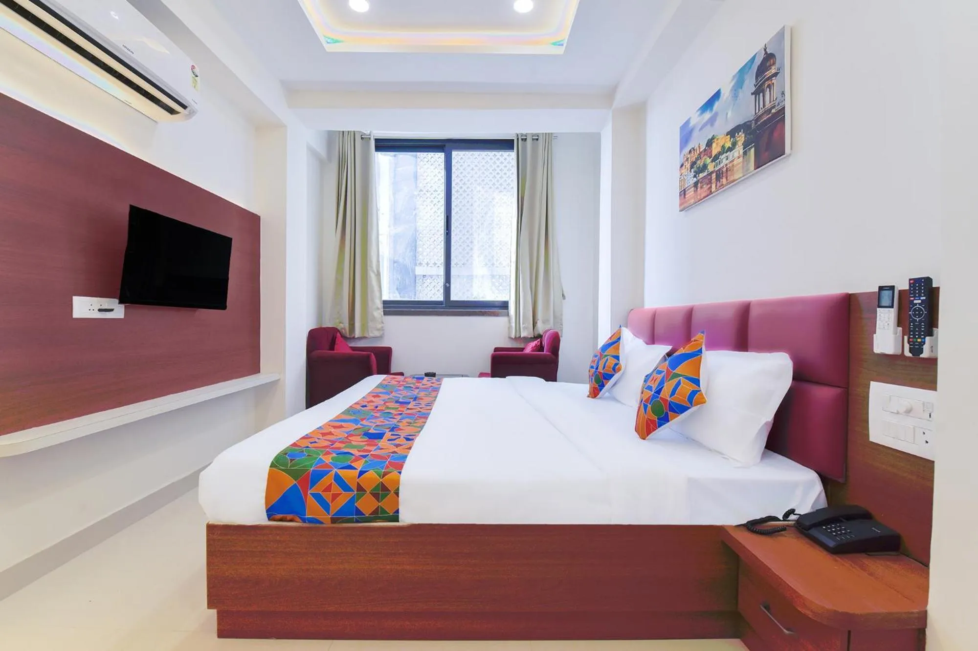 Bed in FabHotel Samrat Regency