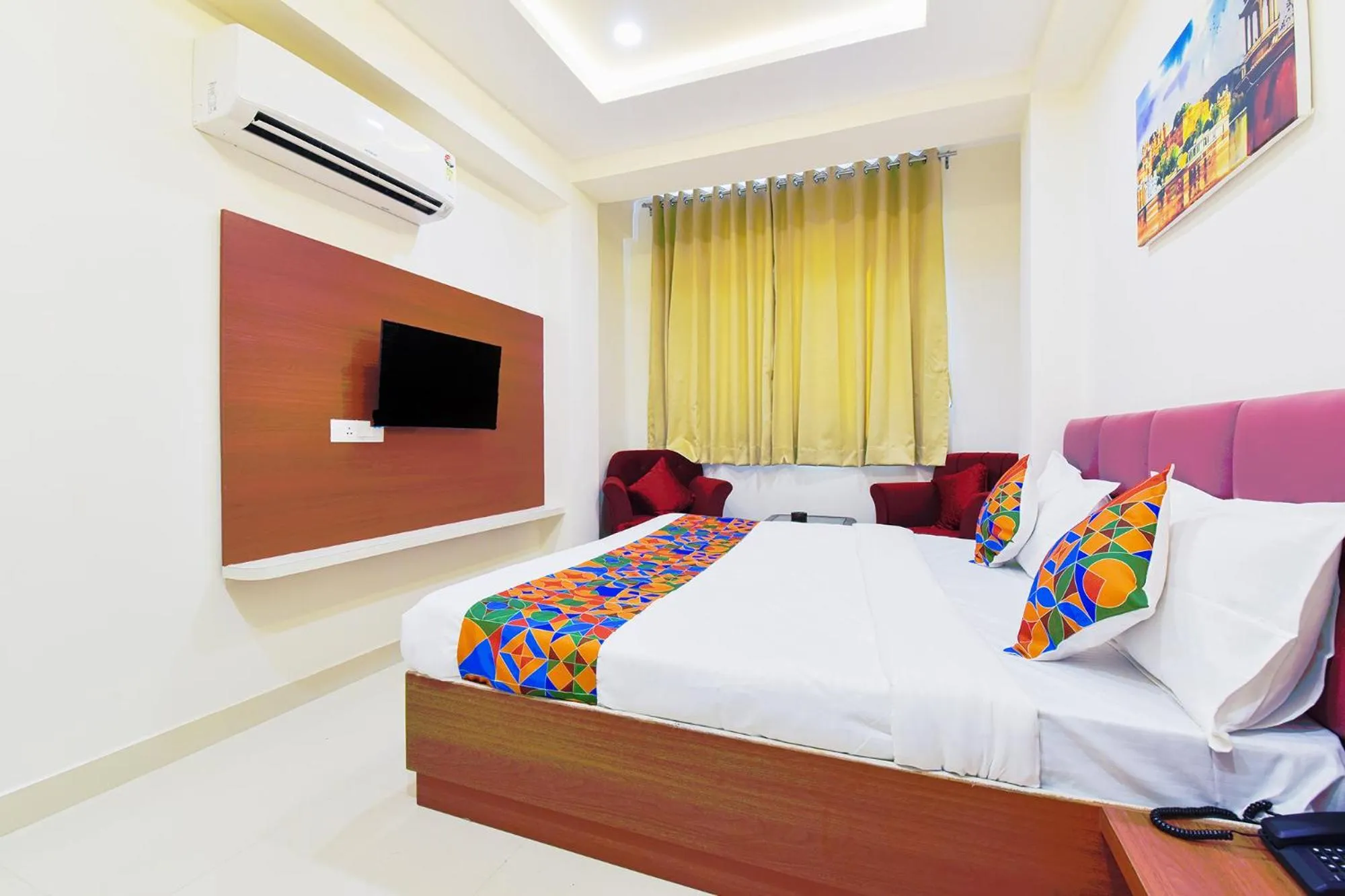 Bed in FabHotel Samrat Regency