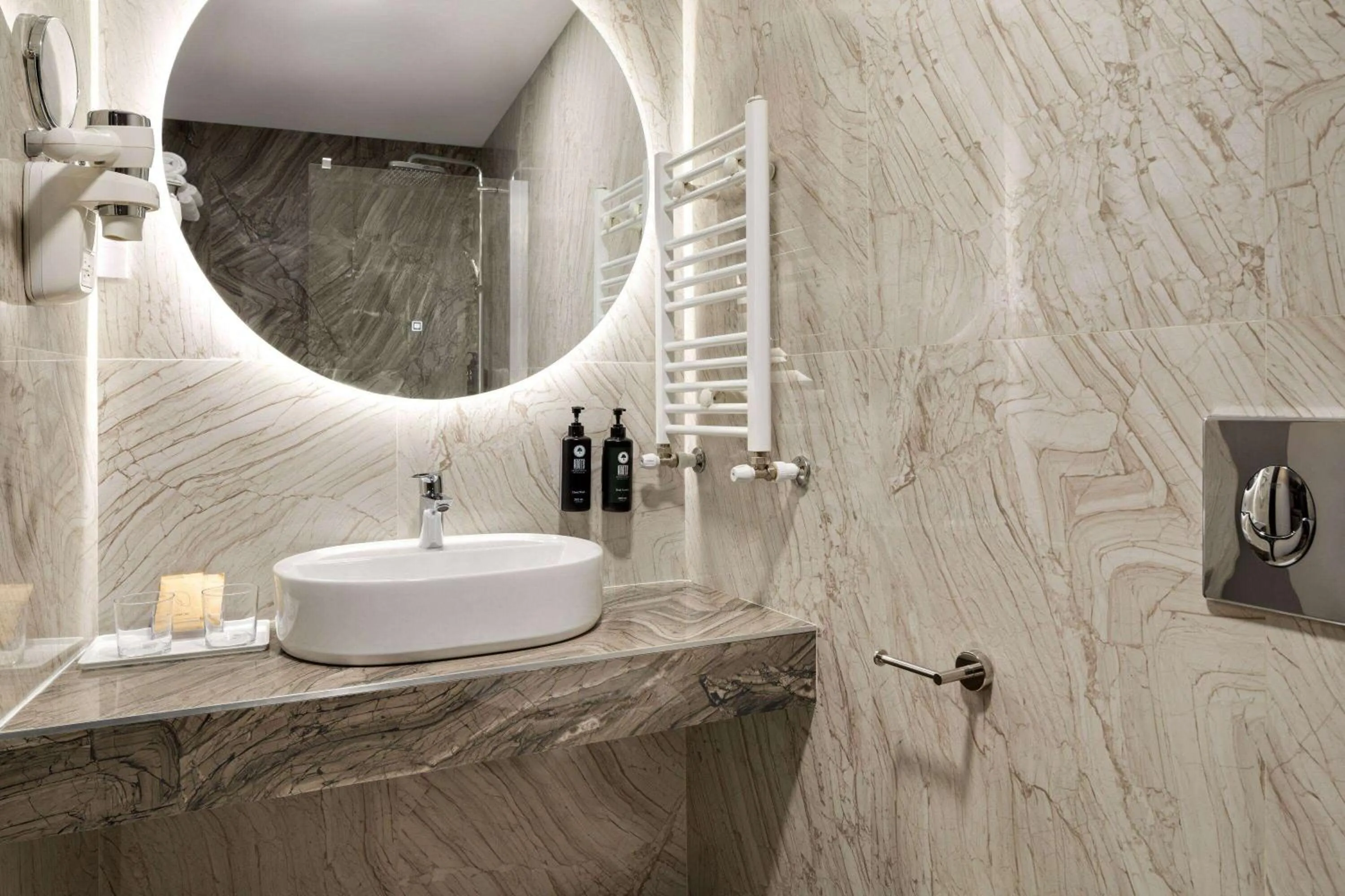 Bathroom in Ramada by Wyndham Bucharest Otopeni Airport