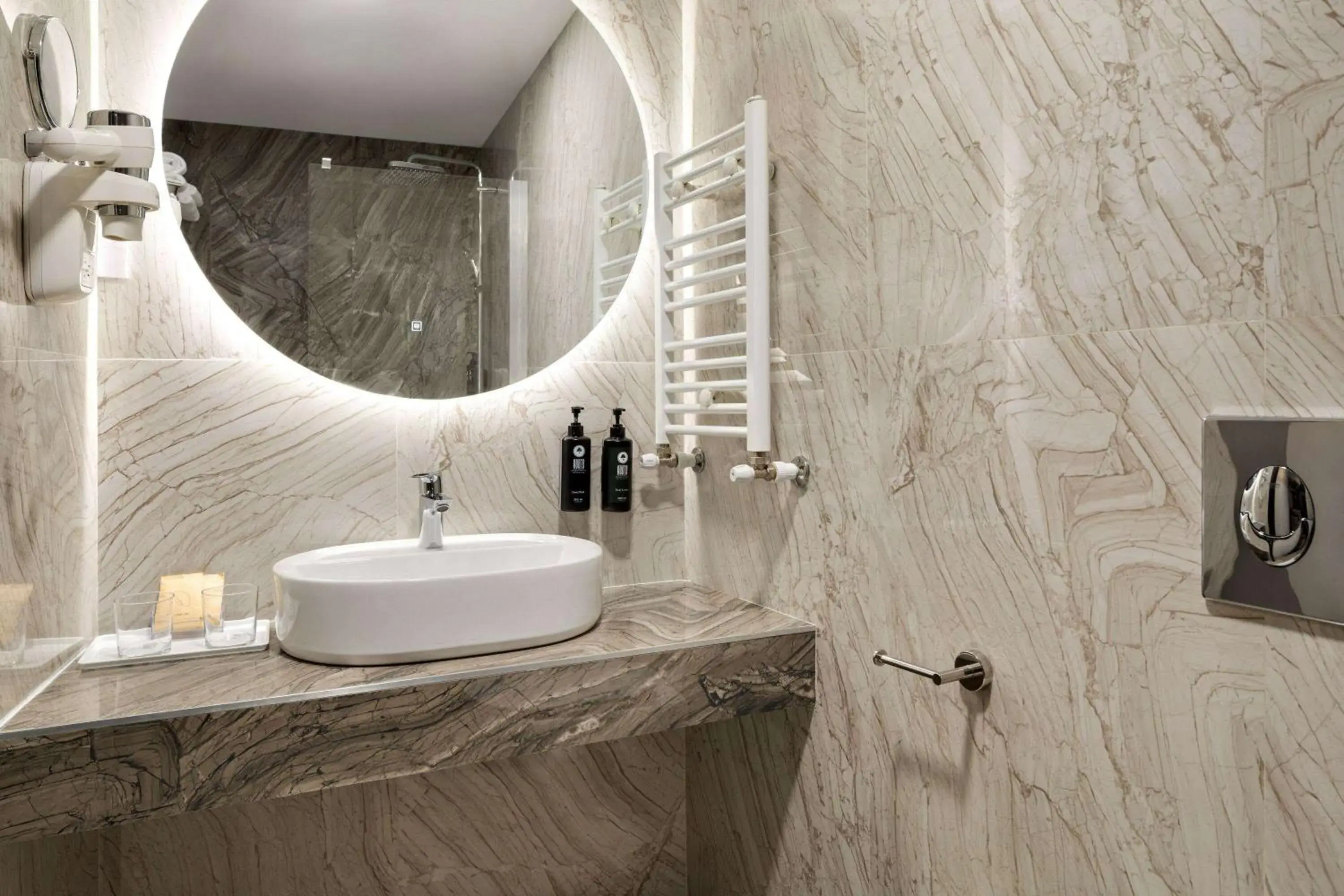 Bathroom in Ramada by Wyndham Bucharest Otopeni Airport Bathroom in Ramada by Wyndham Bucharest Otopeni Airport