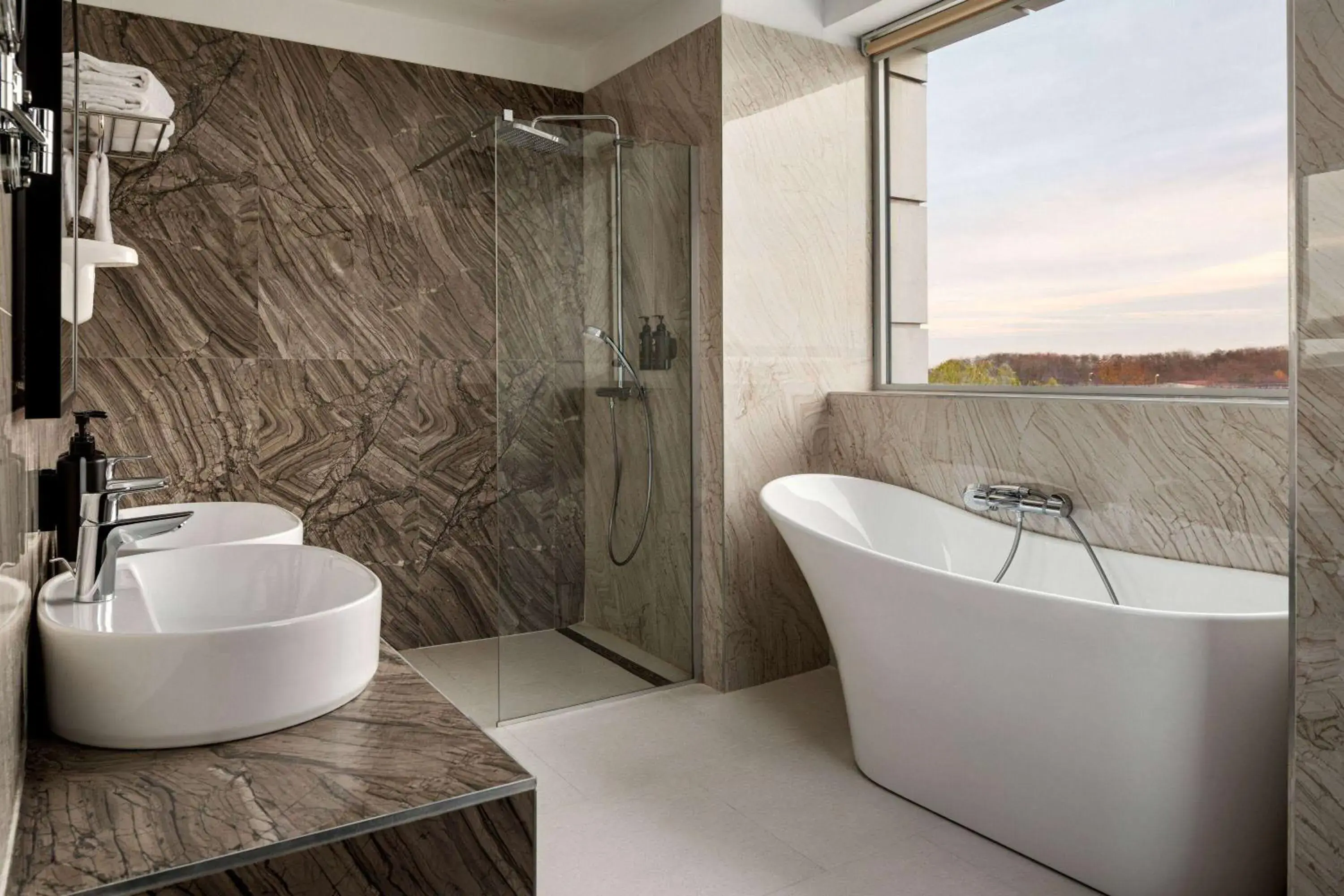 Bathroom in Ramada by Wyndham Bucharest Otopeni Airport Bathroom in Ramada by Wyndham Bucharest Otopeni Airport